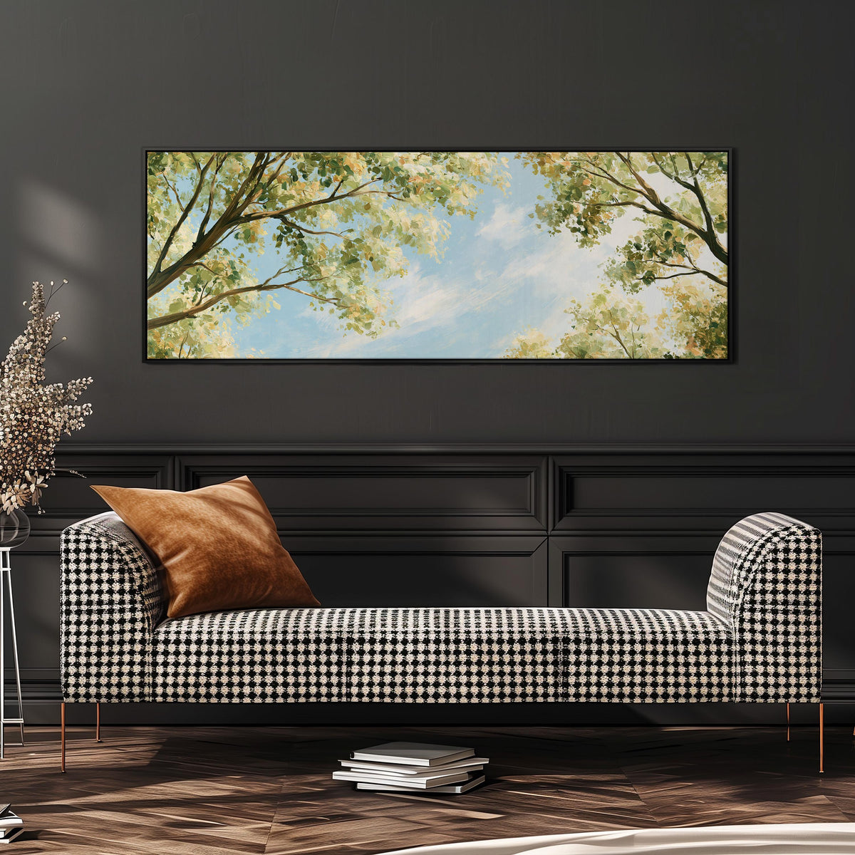 Sunlit leafy branches framing soft clouds wide panoramic canvas print above a bench in a dark living room
