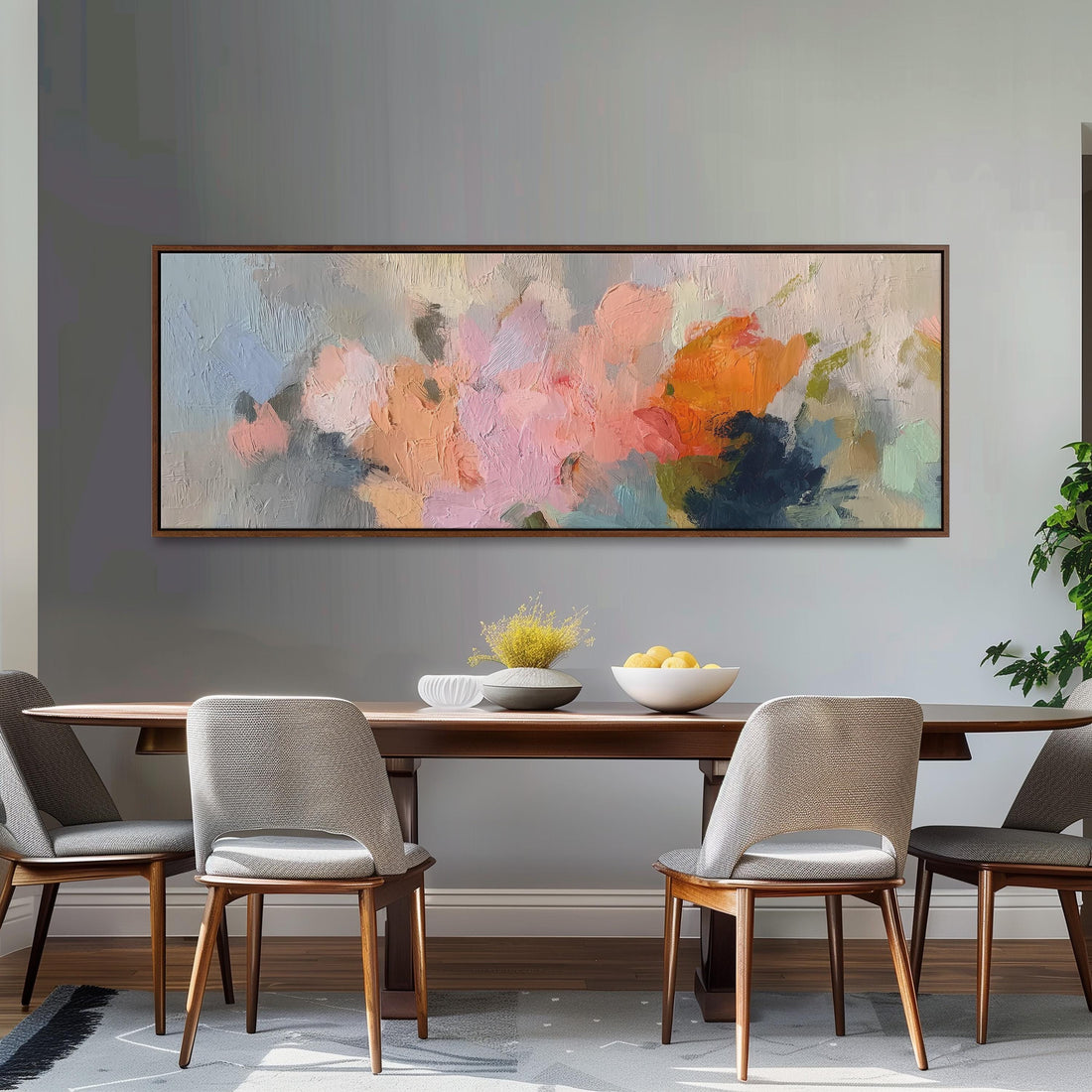 a large, abstract painting hanging on a wall above a brown sofa with two pillows.