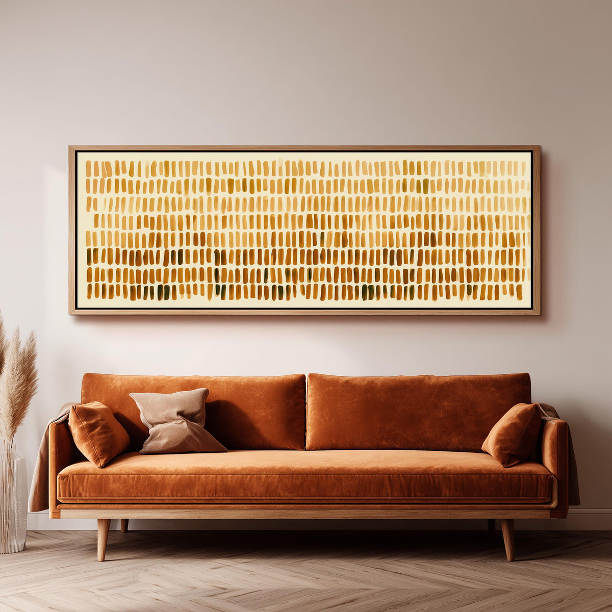 Brushmarks fading from cream to amber panoramic canvas print above a sofa in a living room