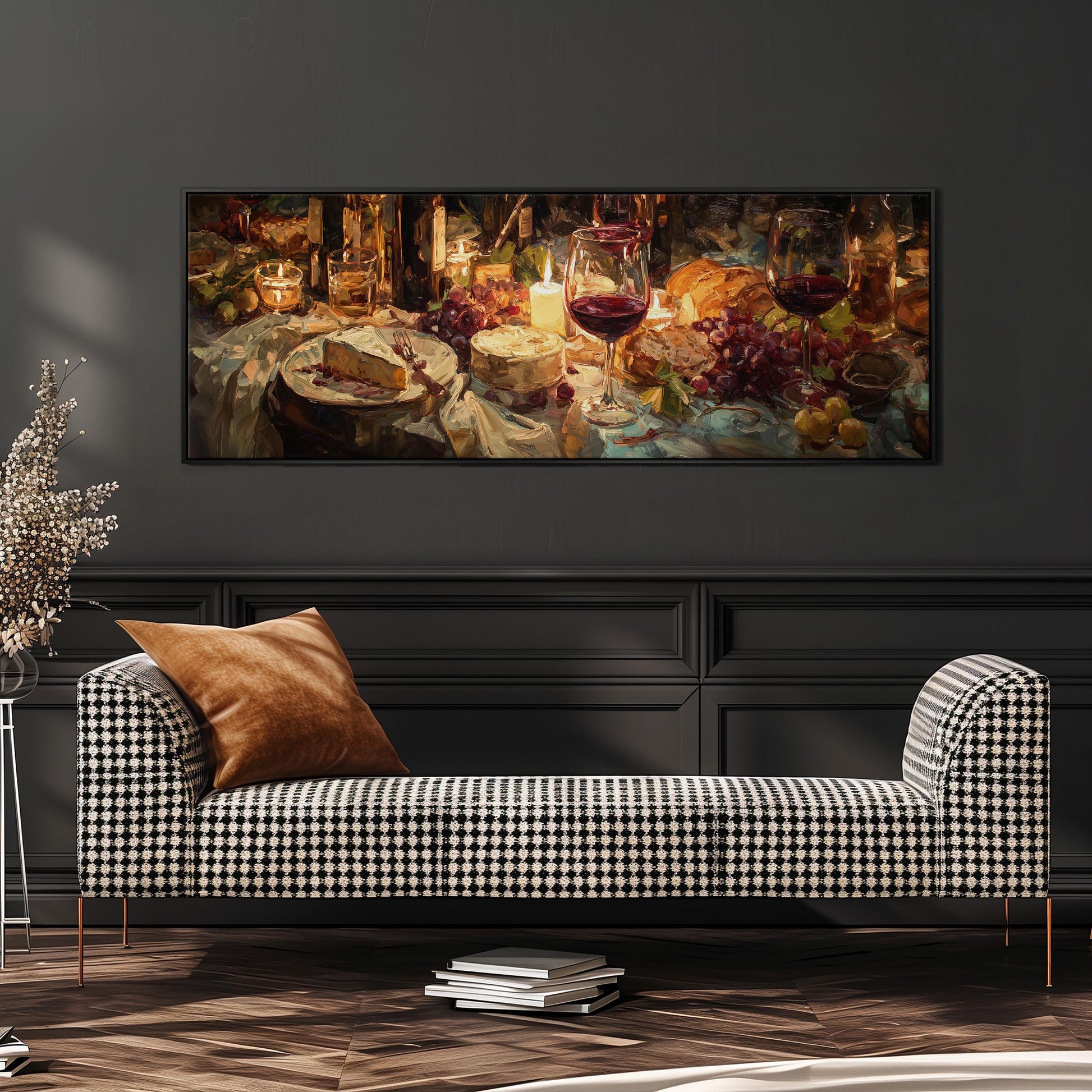 a cozy living room with a black and white checkered sofa, a stack of books, and a large painting of a table set with wine glasses, cheese, and grapes.