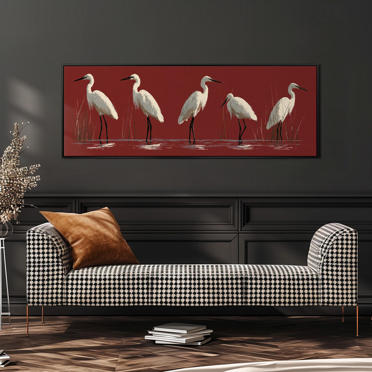White egrets wading on crimson red wide panoramic canvas print above a bench in a dark living room