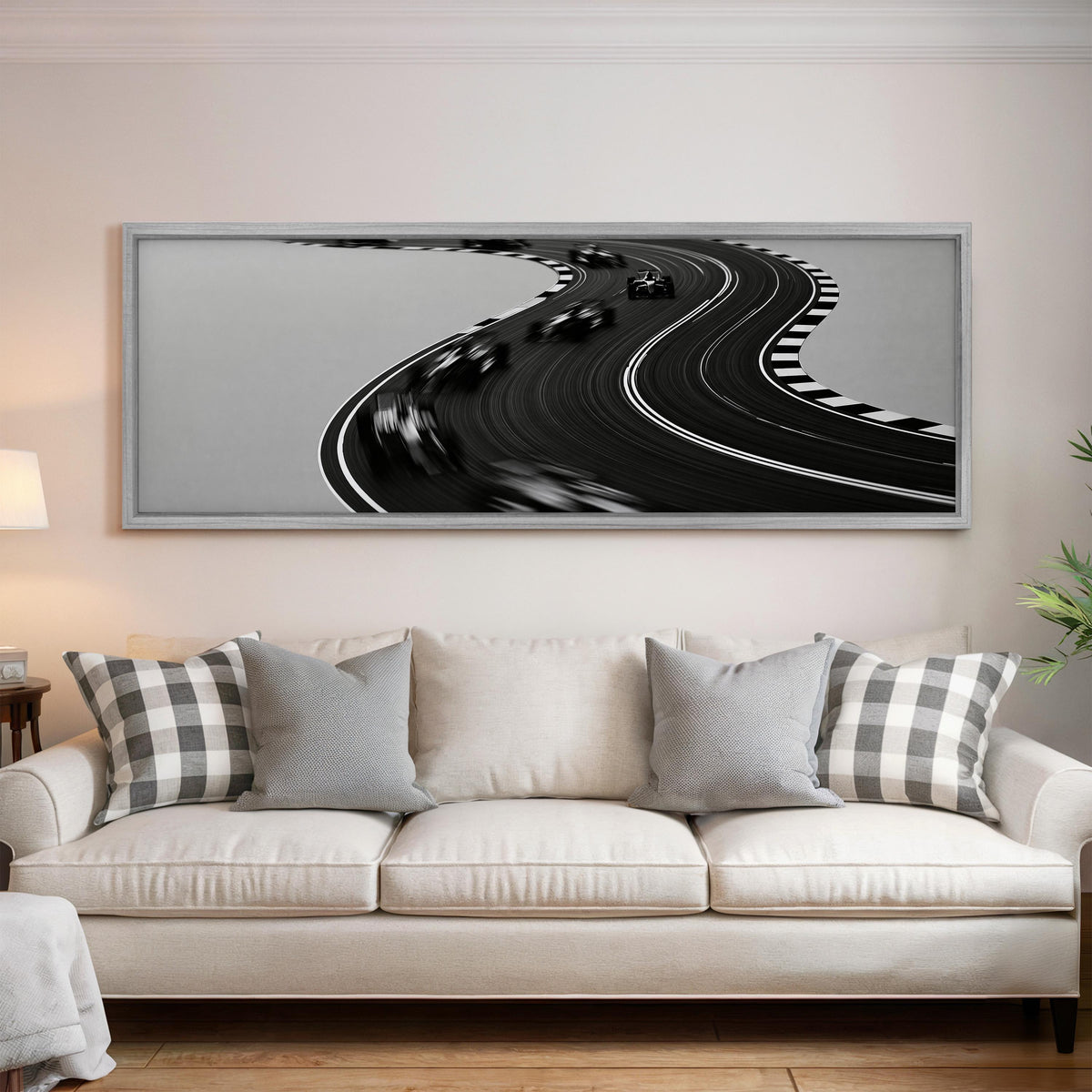 Winding race track in monochrome long horizontal canvas print above a sofa in a living room