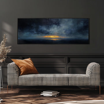 a large black and white checkered sofa with a brown throw pillow, positioned in front of a dark wall with a framed painting depicting a sunset over the ocean.