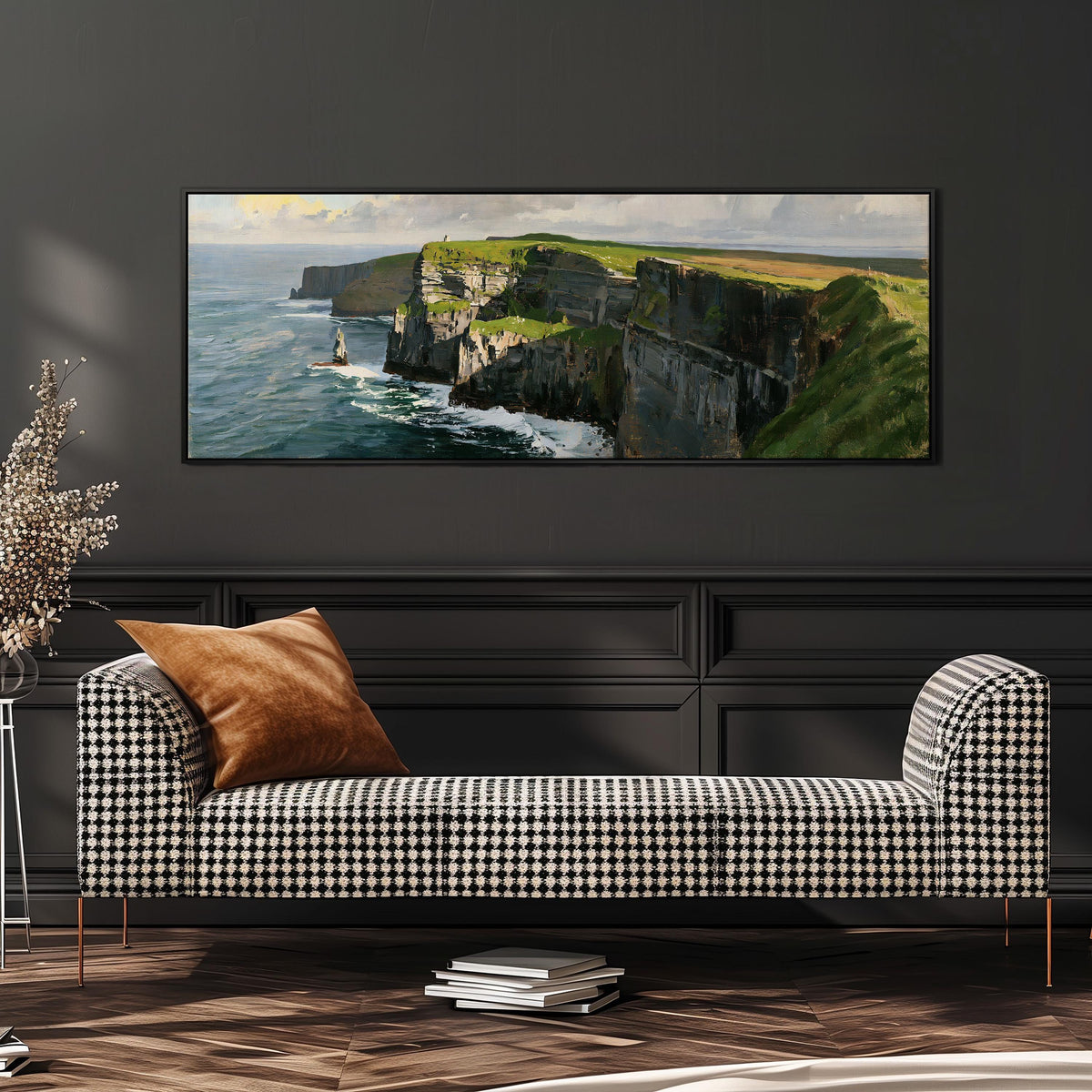 Sunlit sea cliffs with a sea stack wide panoramic canvas print above a bench in a dark living room