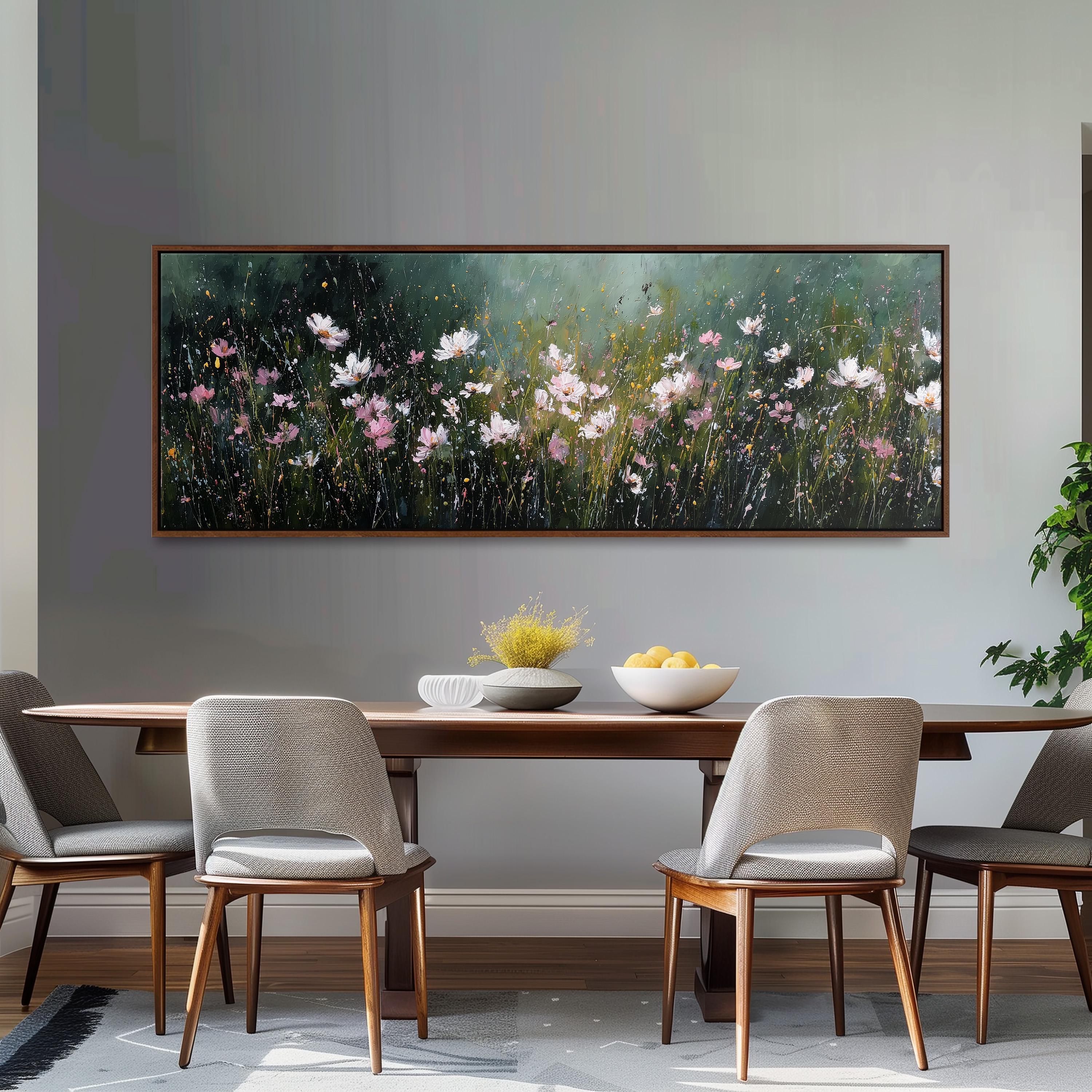 a dining room with a large painting of flowers hanging on the wall above a wooden table with four chairs. The table is set with a bowl of fruit and a vase of flowers, creating a cozy and inviting atmosphere.