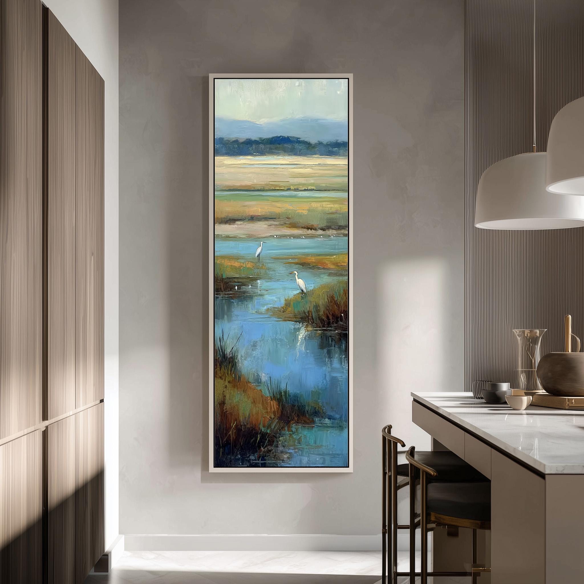 a large painting of a serene landscape with a body of water and two birds, hanging on a wall in a modern kitchen.