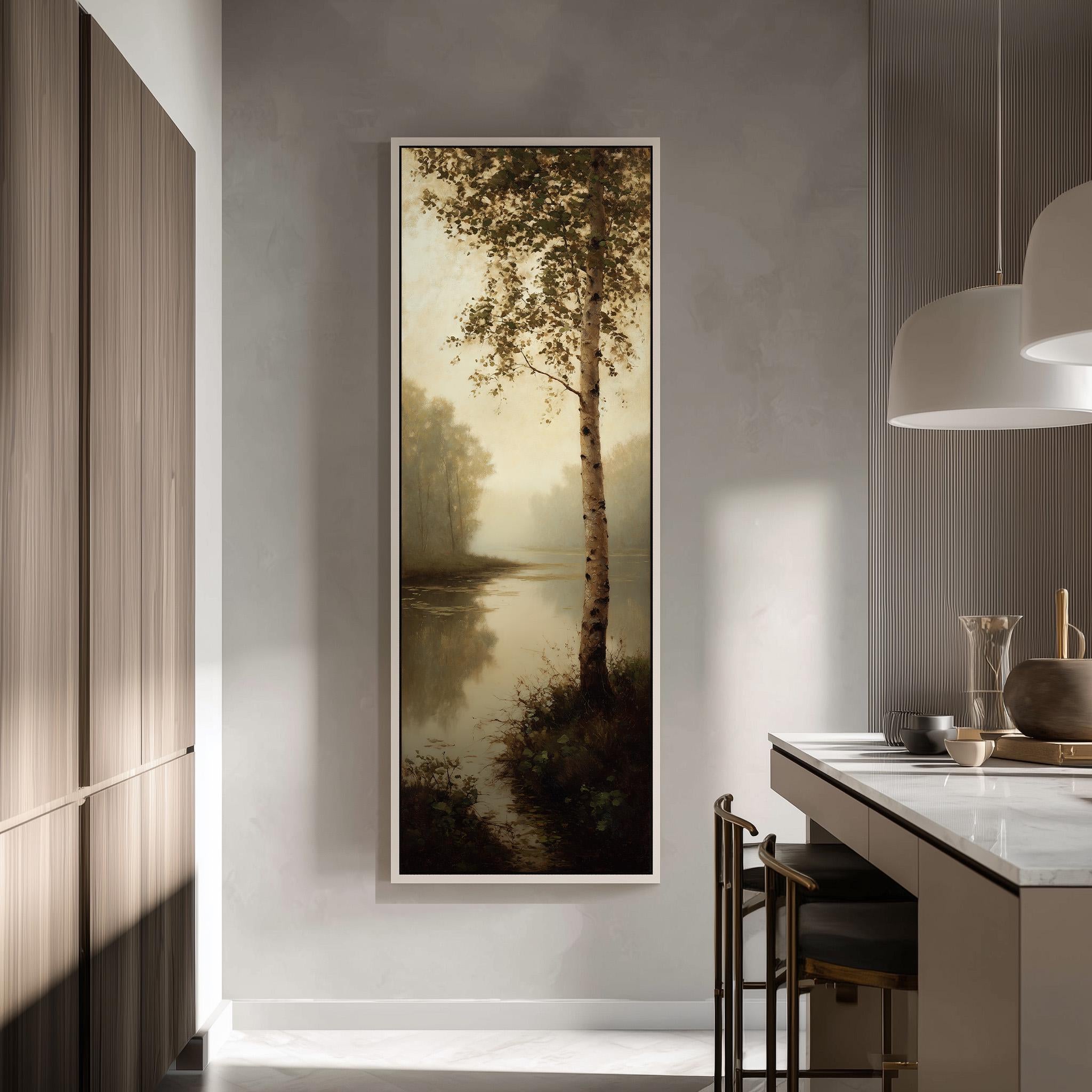 a large painting of a tree on a wall, with a serene landscape of water and trees in the background. The painting is framed and hangs in a modern, minimalist kitchen with a countertop and chairs.