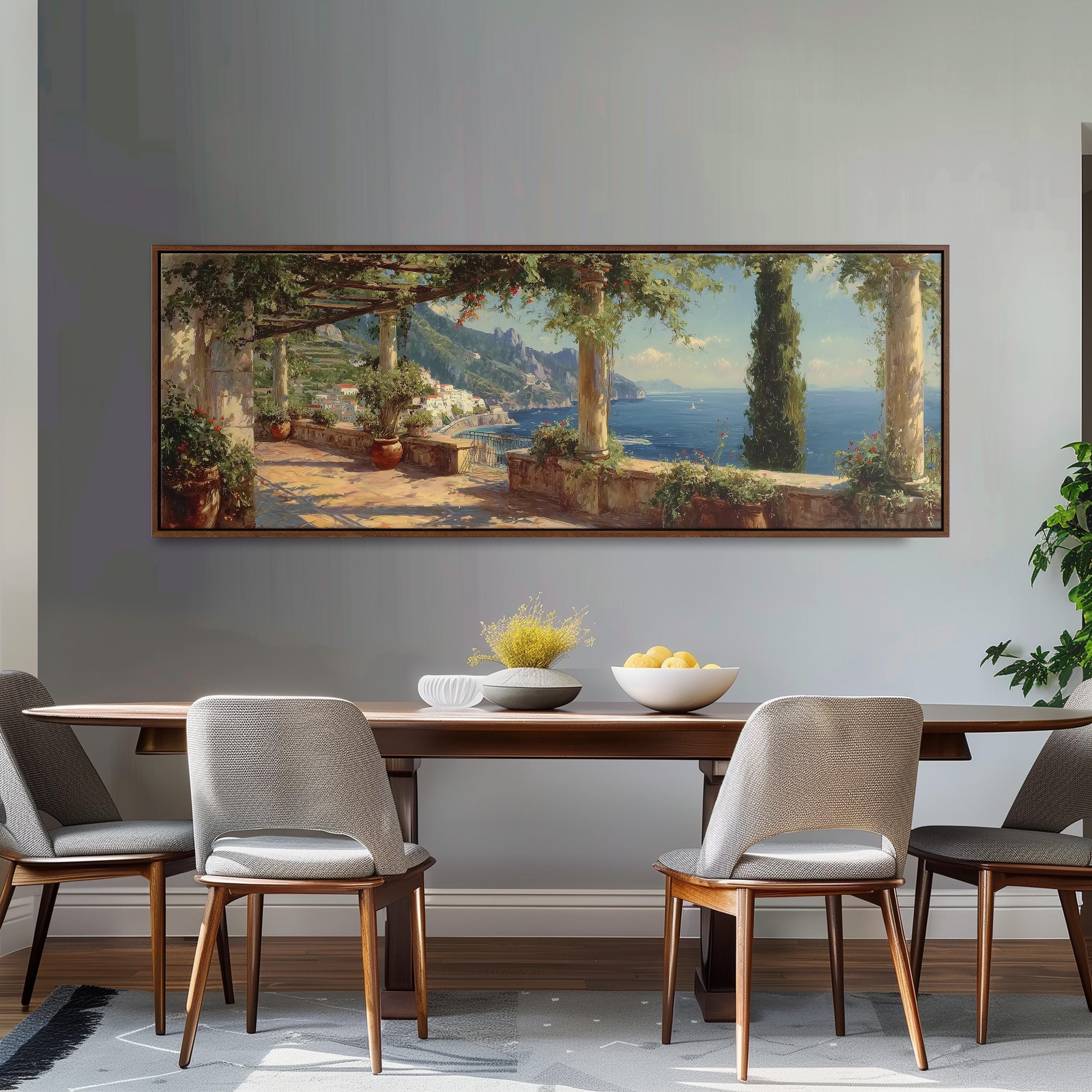 a large painting of a scenic coastal landscape hanging on a wall above a wooden dining table with four chairs. The painting depicts a picturesque seaside setting with a path leading to a cliff overlooking the ocean.