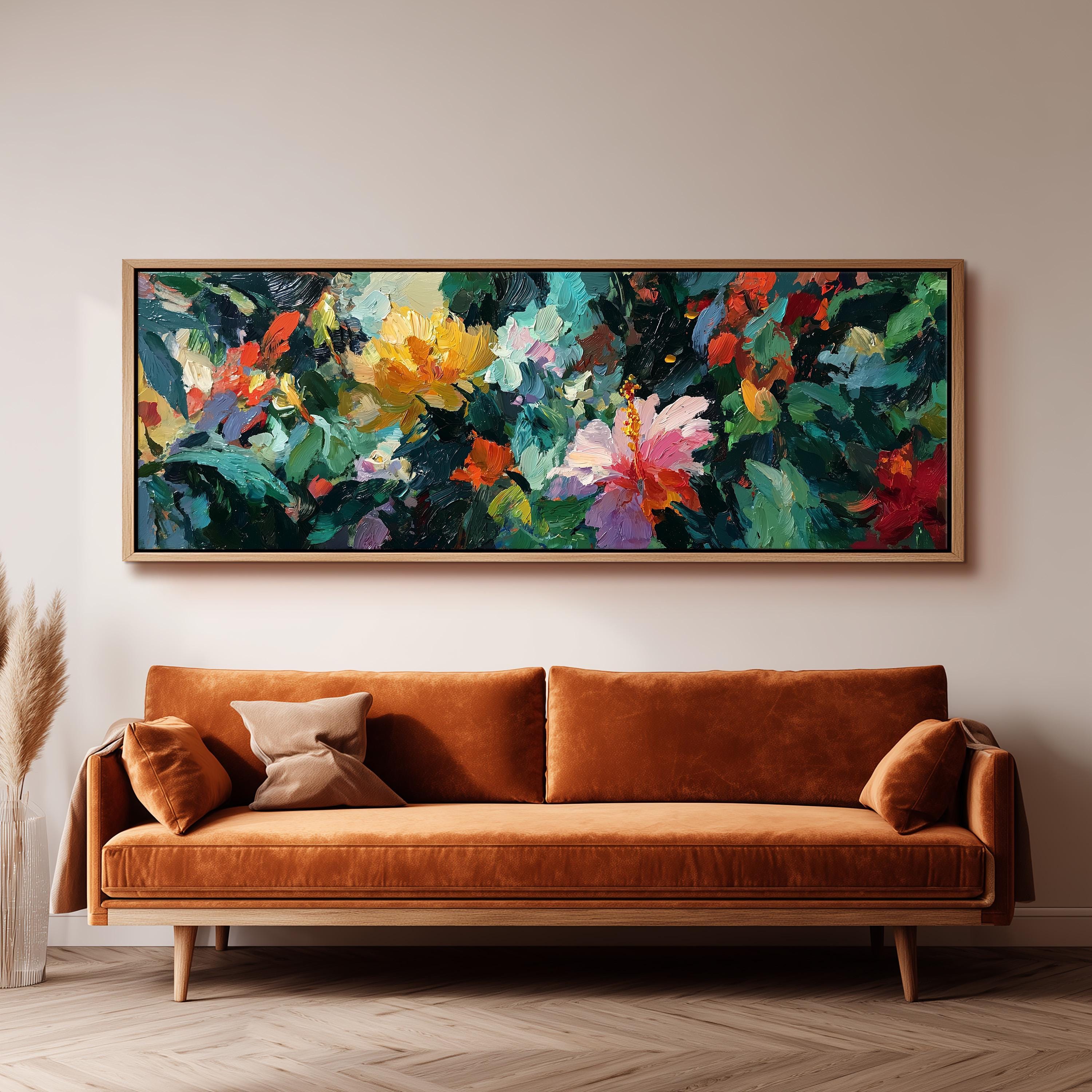 a large, vibrant painting of flowers hanging on a wall above a brown sofa.