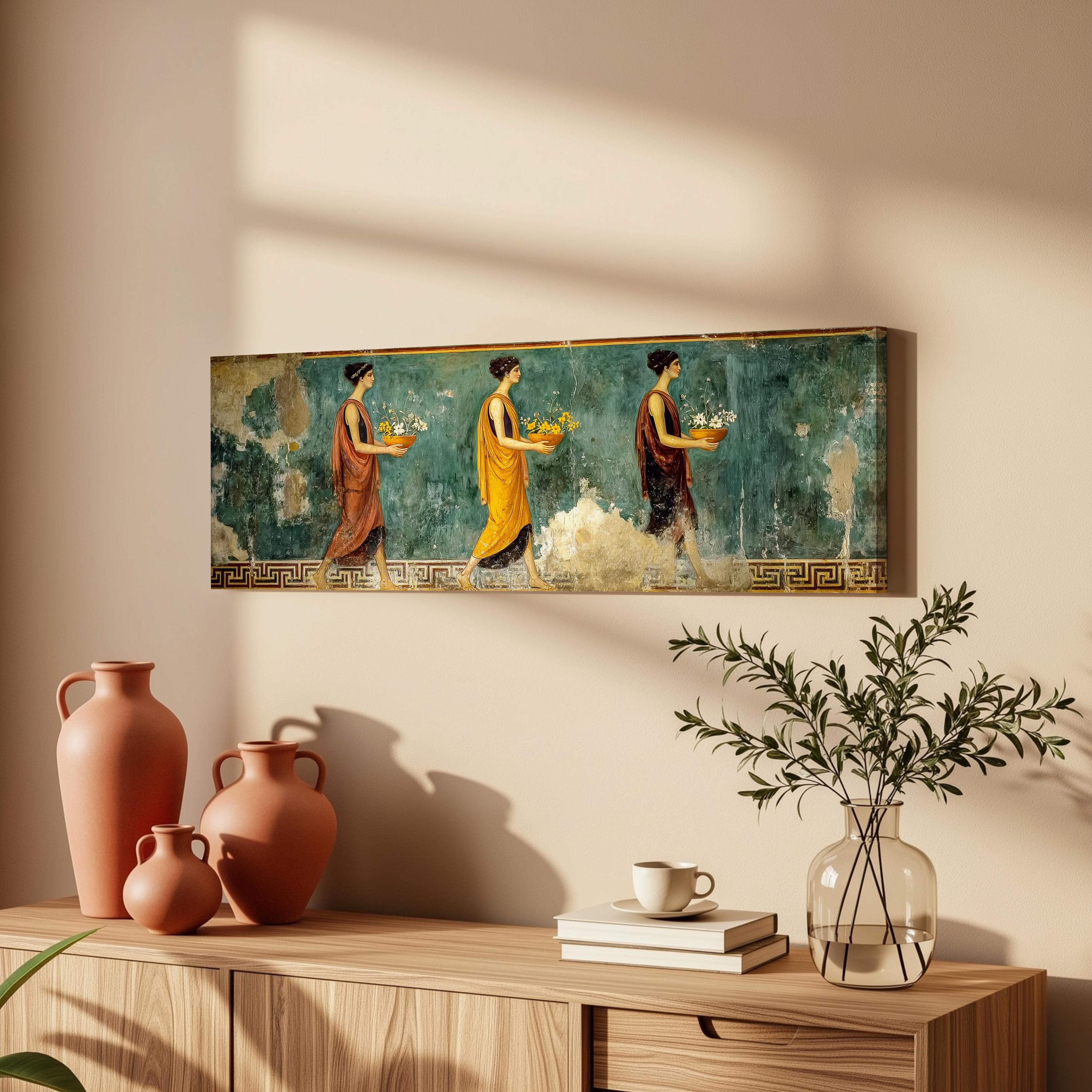 a wooden cabinet with a painting of three women in colorful dresses hanging on the wall above it. The cabinet also has three orange vases, a white coffee cup, and a stack of books on top.