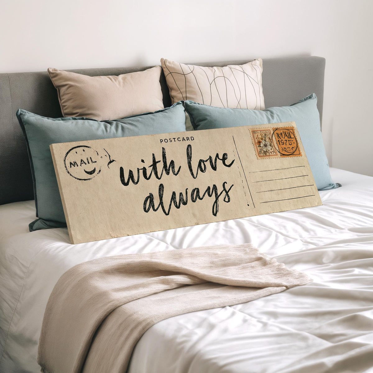 Vintage postcard saying with love always wide panoramic canvas print laid on a bed to show its size