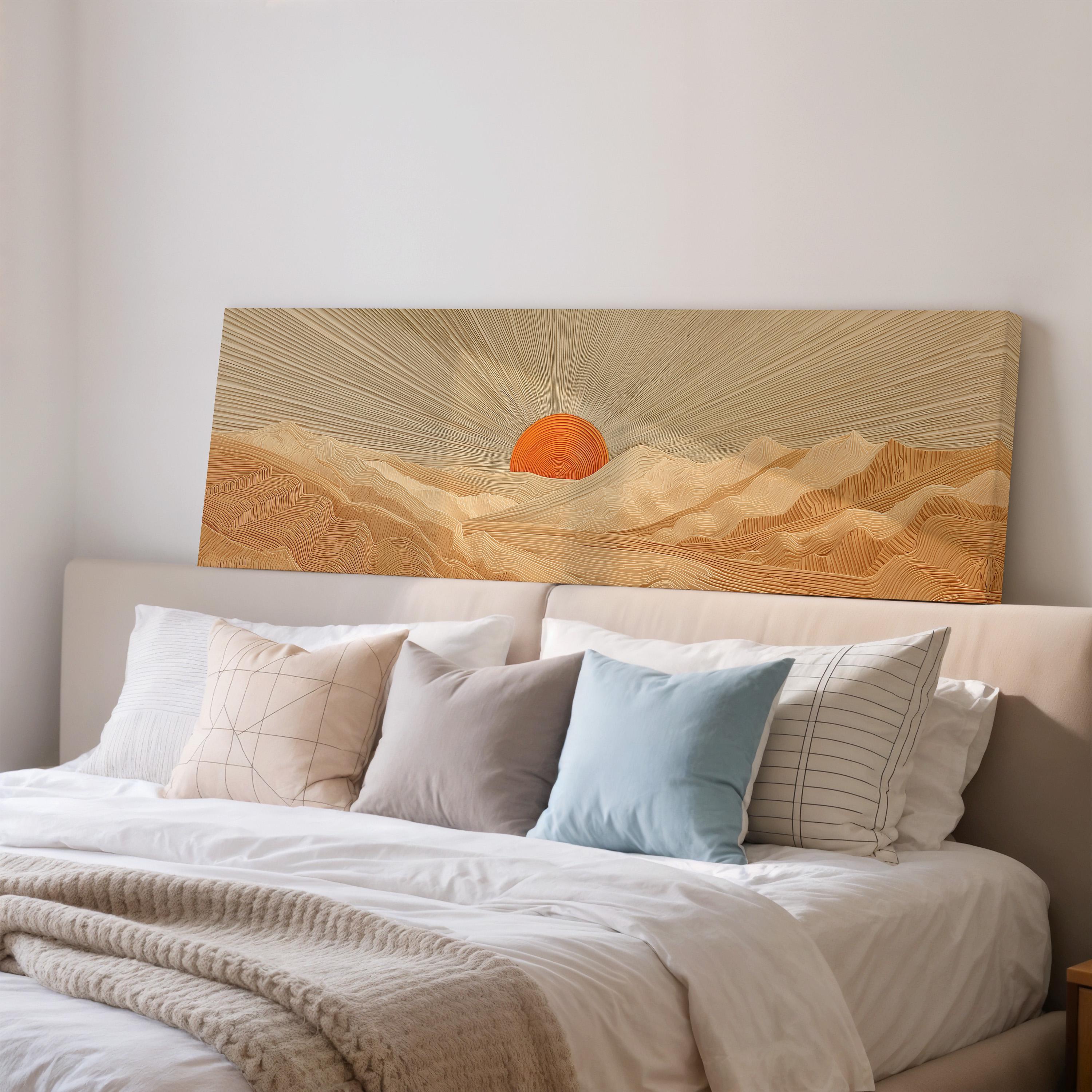 a large bed with a white comforter and pillows, and a large canvas print of a sunrise over mountains is displayed above the bed.