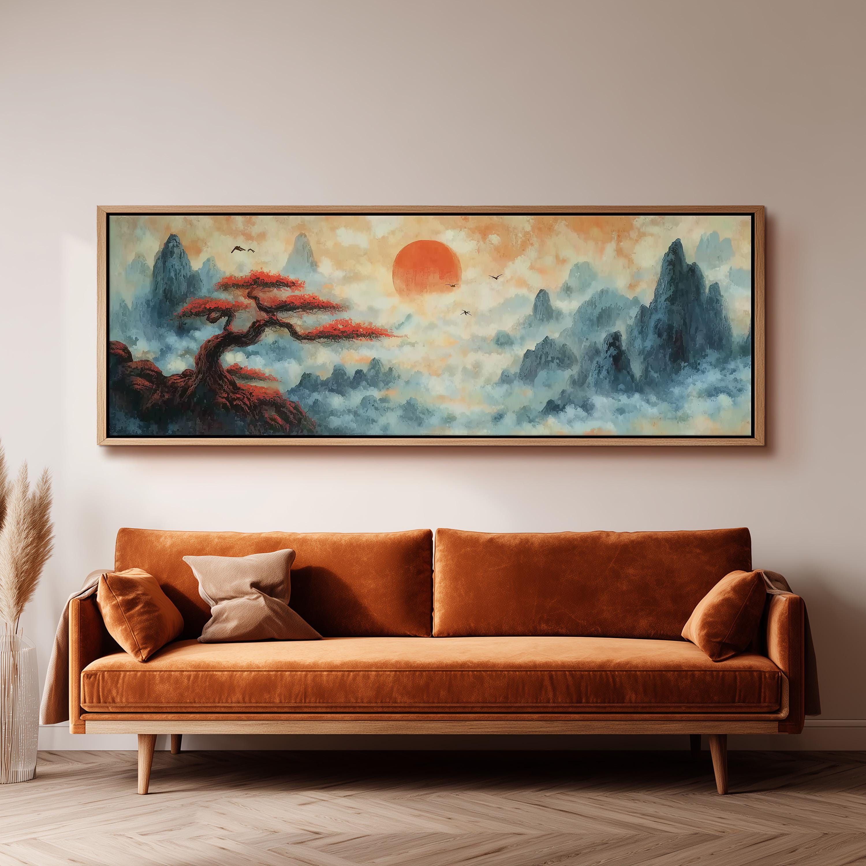 a large, framed painting of a serene landscape with a tree and mountains, hanging on a wall above a brown sofa.