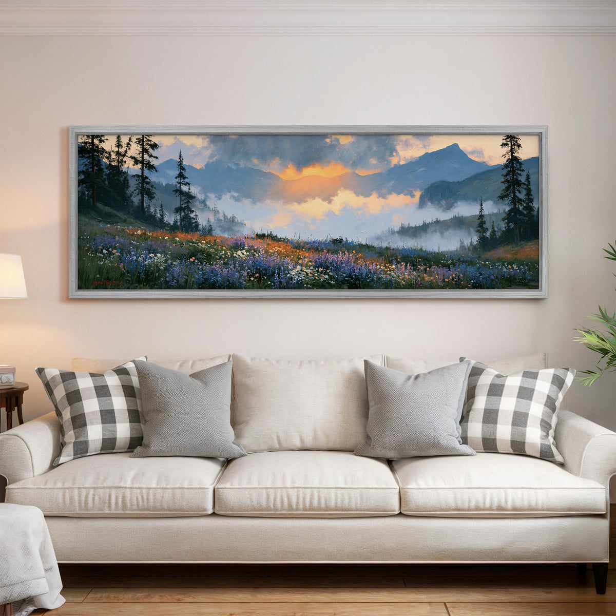 Alpine wildflower meadow at sunset panoramic canvas print above a white sofa in a bright living room