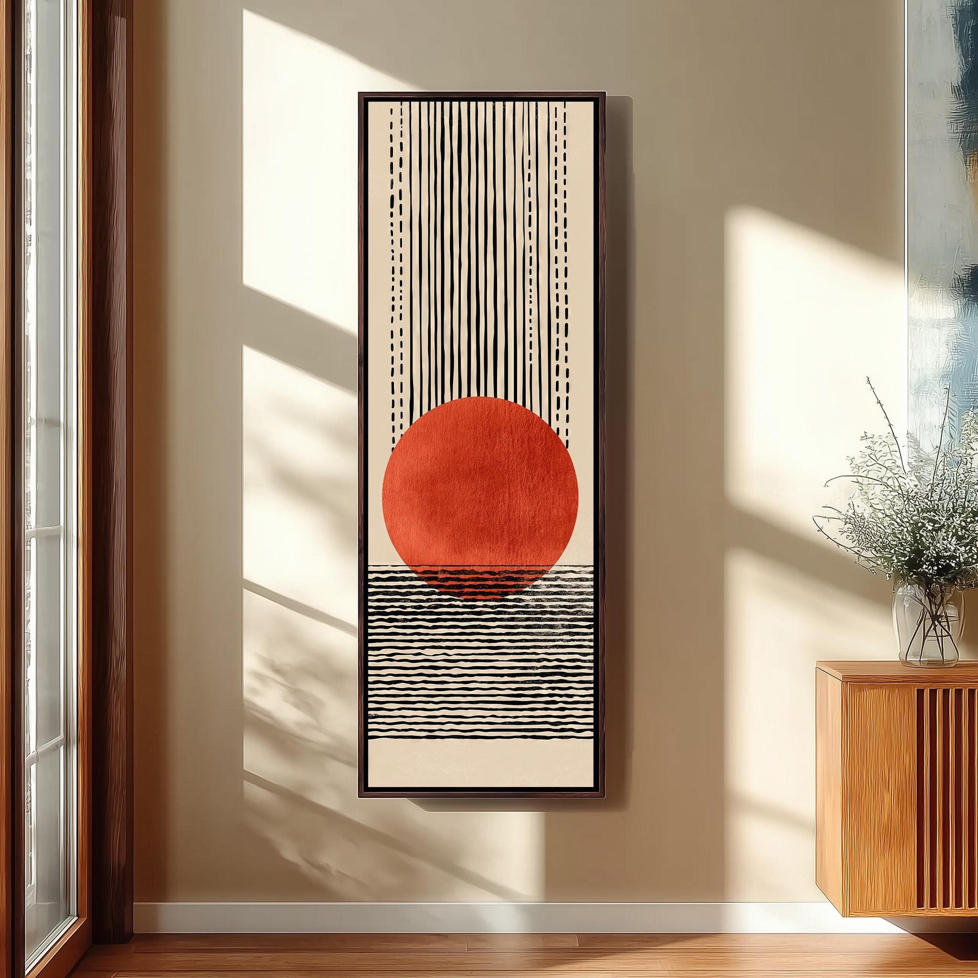 a large abstract painting hanging on a wall, depicting a red circle with a black and white striped pattern.
