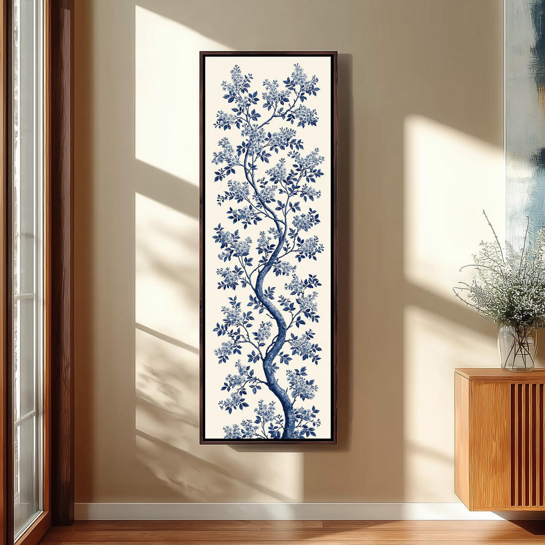 Blue chinoiserie blossom branch on cream long vertical canvas print in a sunlit living space