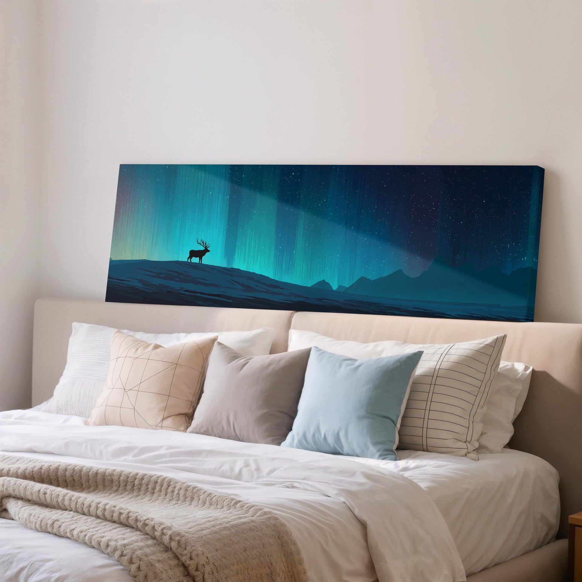 a large canvas print of a serene night landscape with a silhouetted deer standing on a hill against a backdrop of a starry sky.