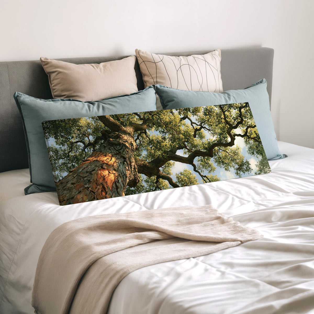 Ancient oak trunk and branches seen from below wide panoramic canvas print laid on a bed to show its size