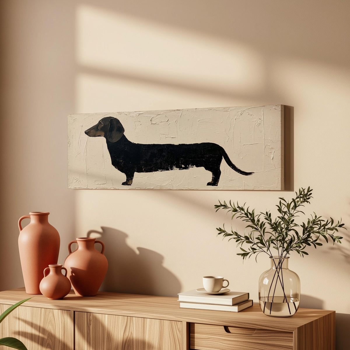 Black dachshund silhouette long horizontal canvas print above a wooden sideboard