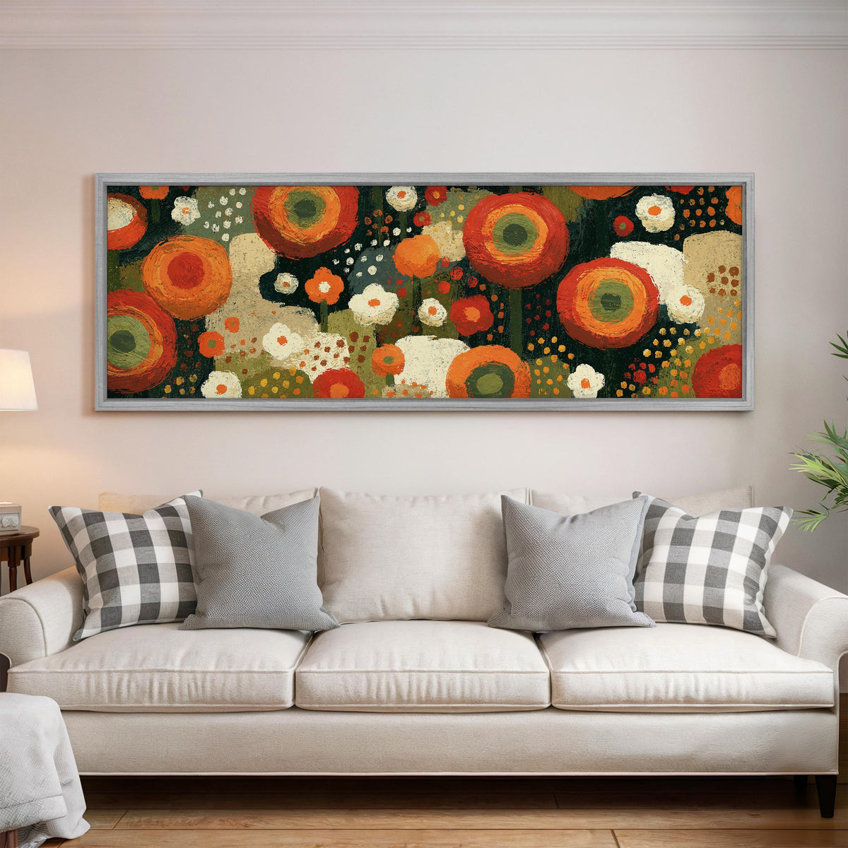 Concentric poppy rings panoramic canvas print above a white sofa in a bright living room