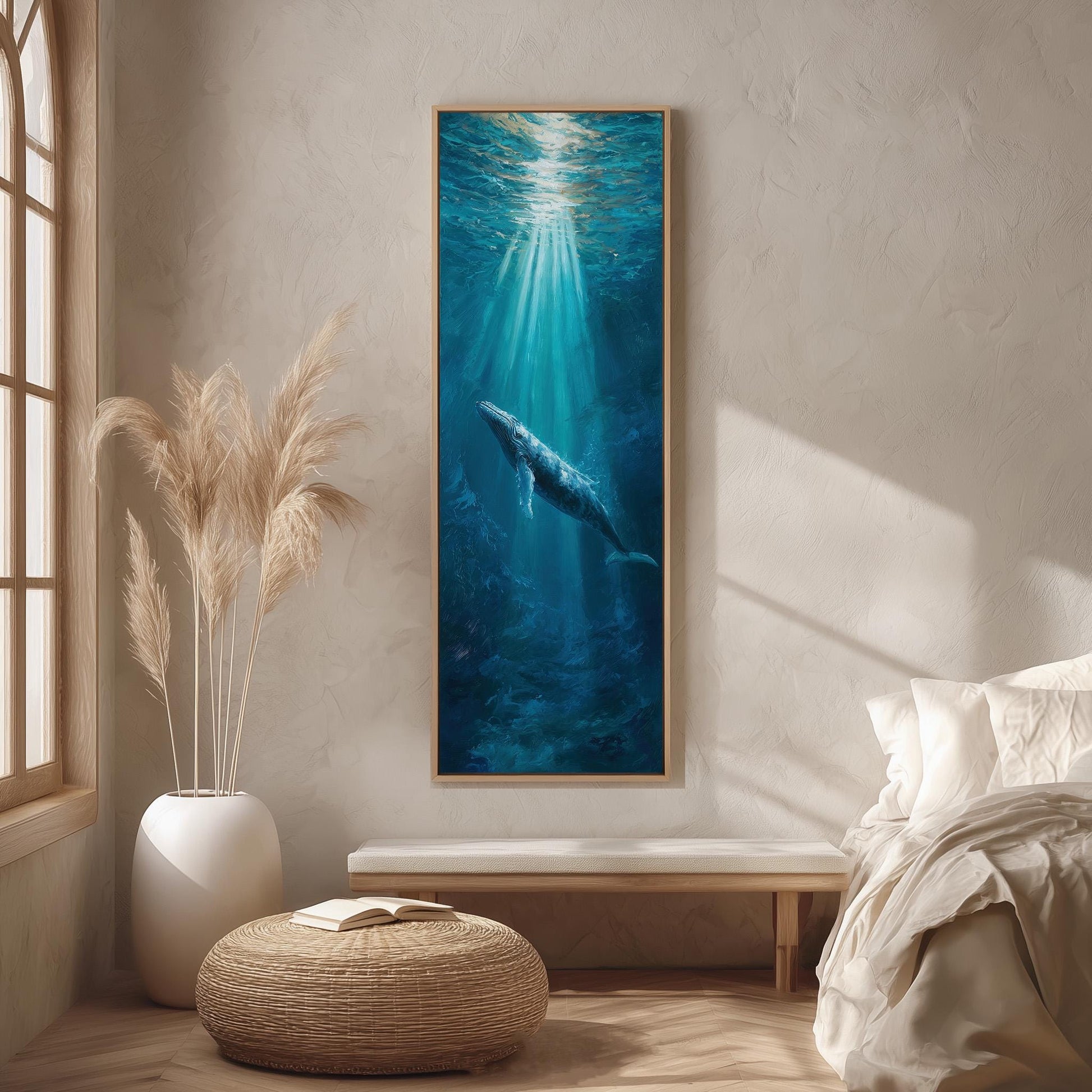 a large painting of a whale swimming in the ocean, hanging on a wall in a room with a window and a bed.