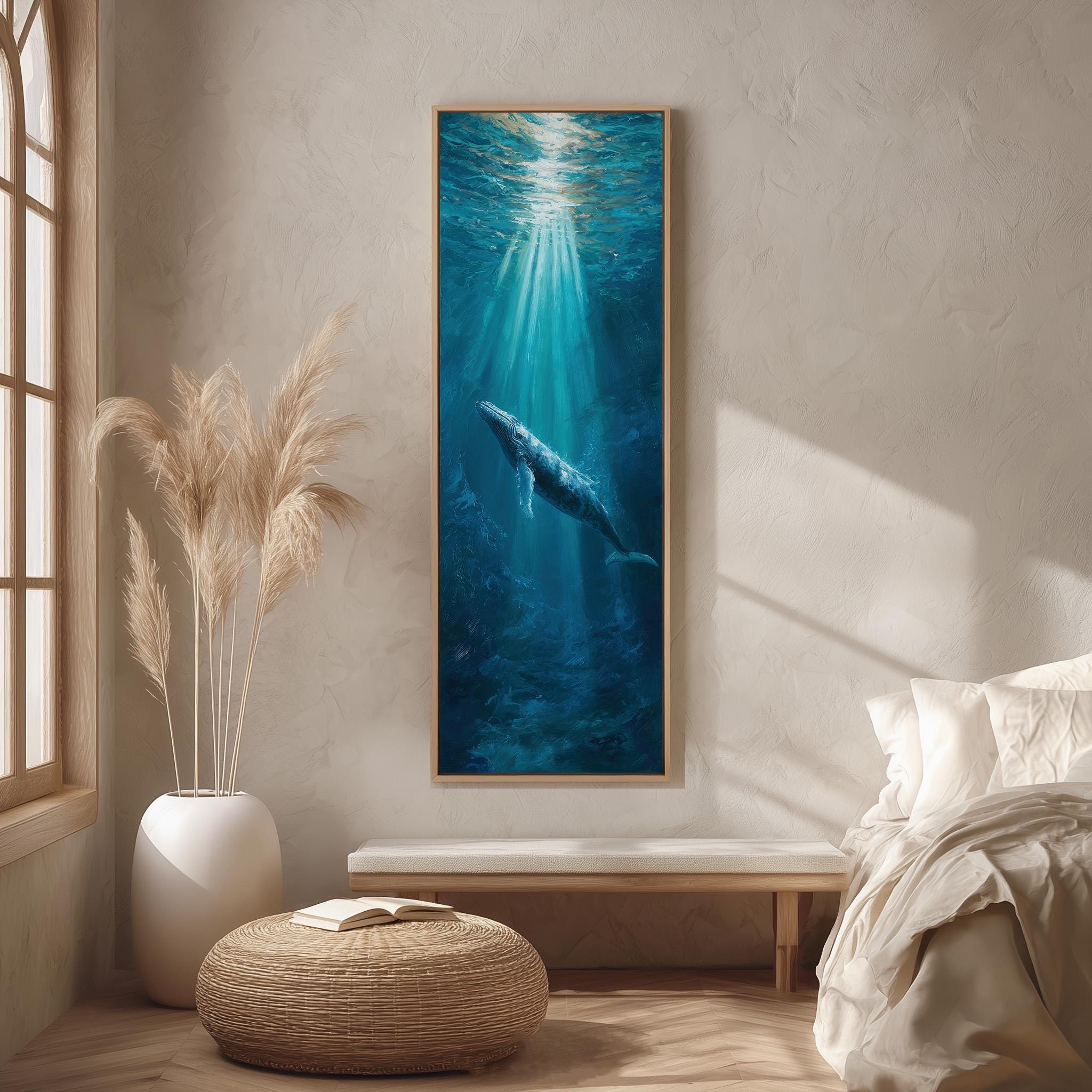 a large painting of a whale swimming in the ocean, hanging on a wall in a room with a window and a bed.