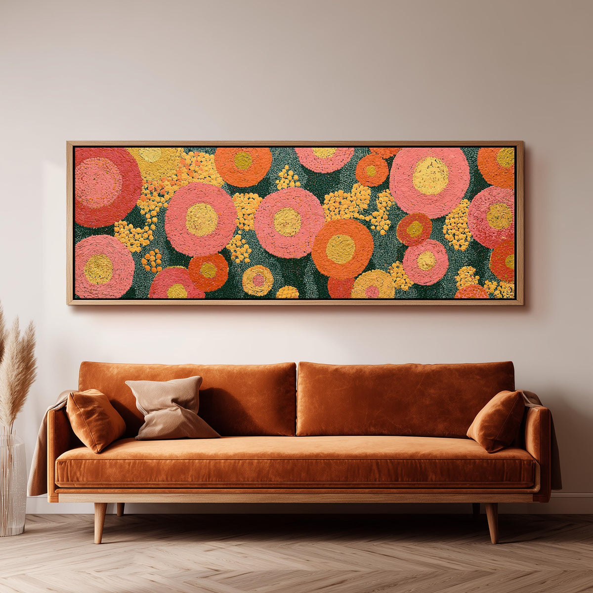 Pink circle blooms panoramic canvas print above a sofa in a living room
