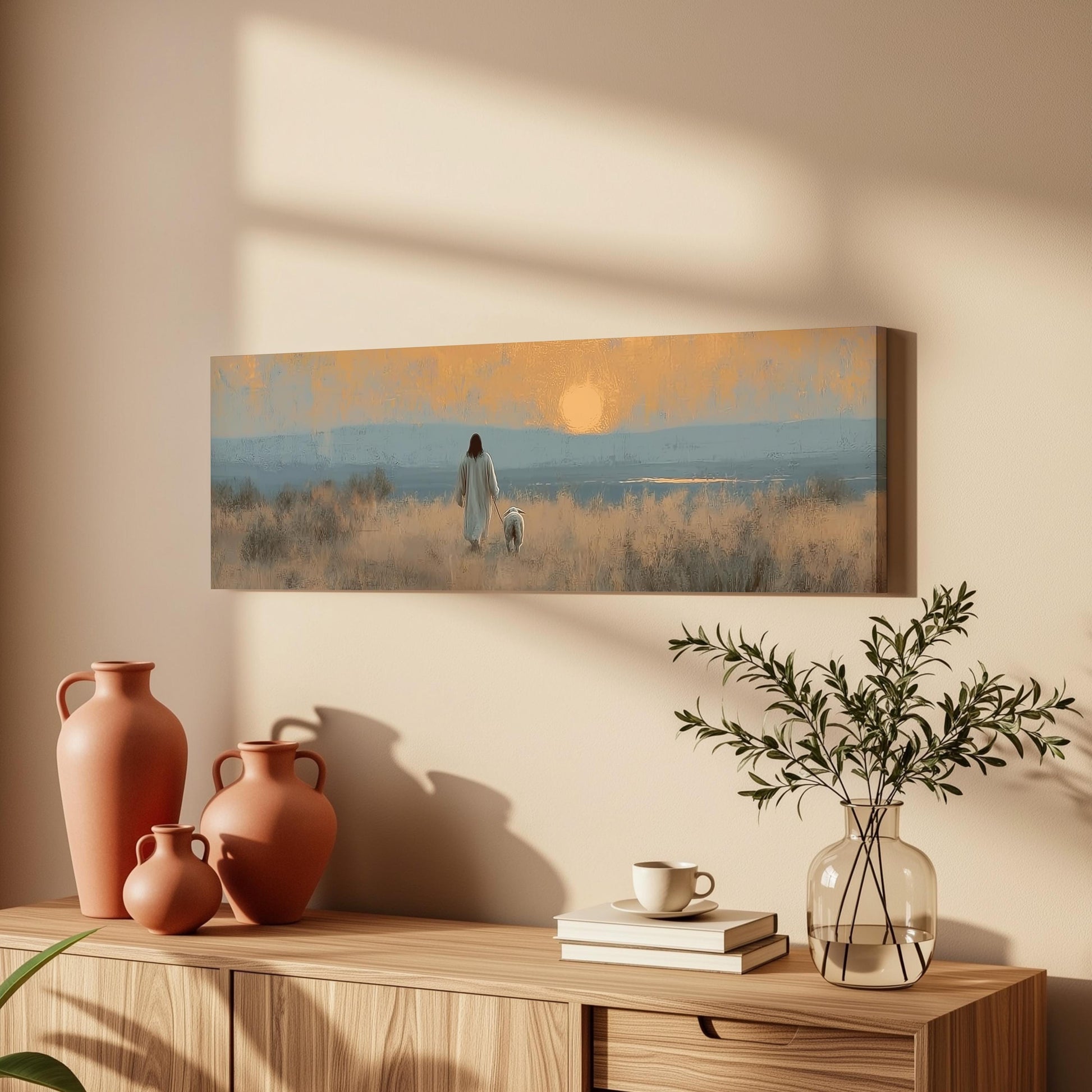 a serene indoor setting with a painting of a person walking in a field, a vase with greenery, and a wooden dresser with books and a coffee cup.