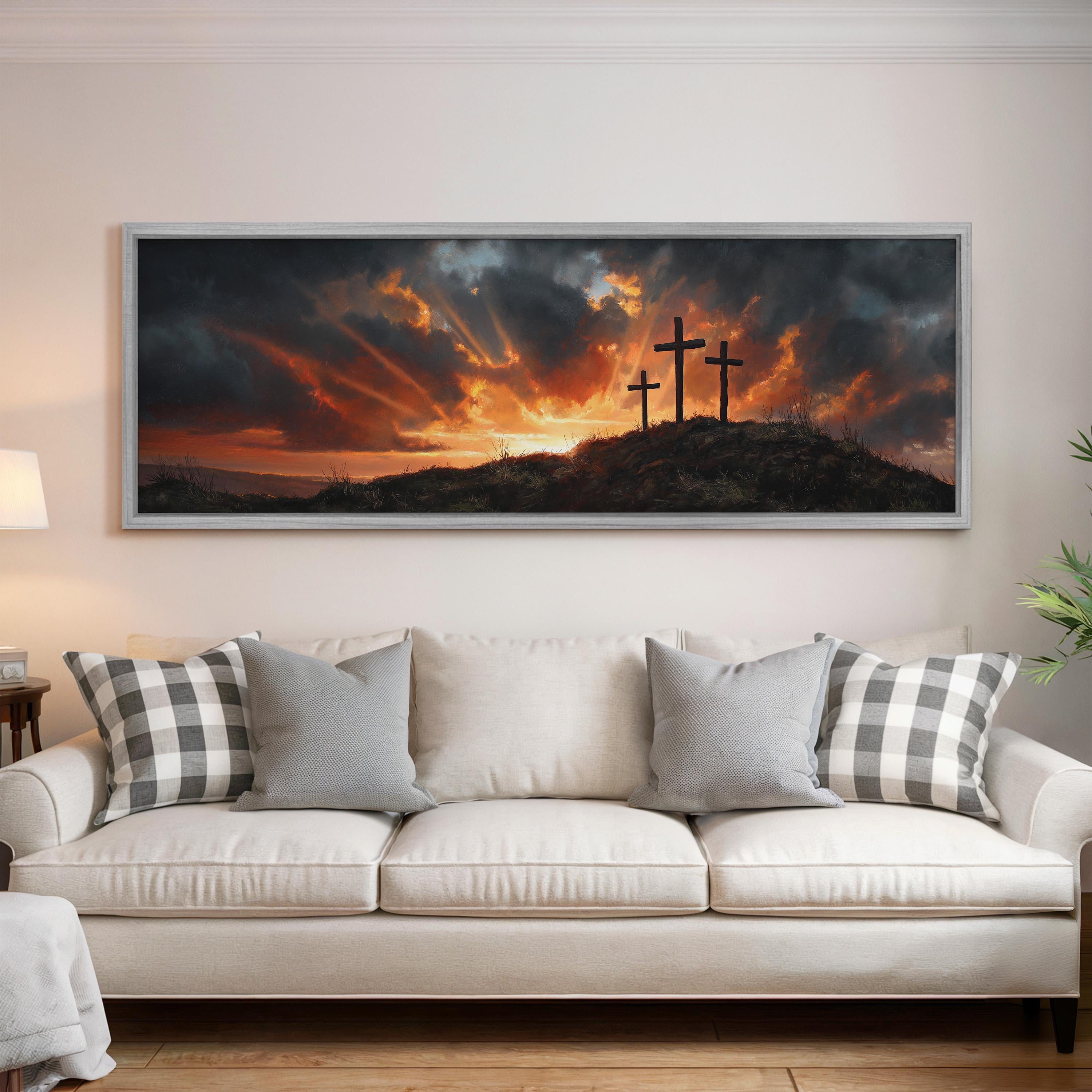 a large framed painting of a dramatic landscape with a dramatic sky and three crosses on a hill, creating a striking and spiritual atmosphere.