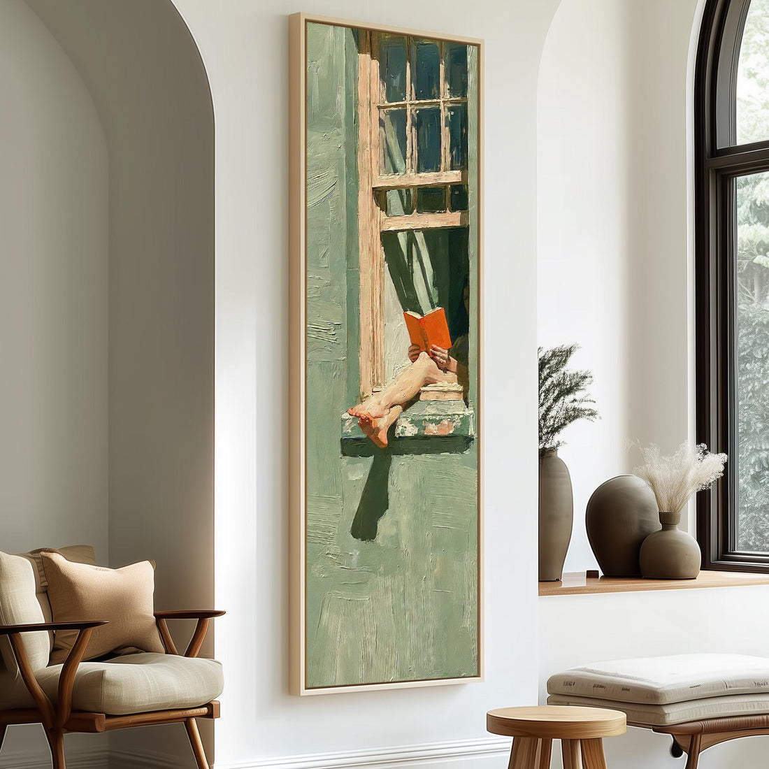 Woman reading in a sage green window long vertical canvas print in a sunlit living space