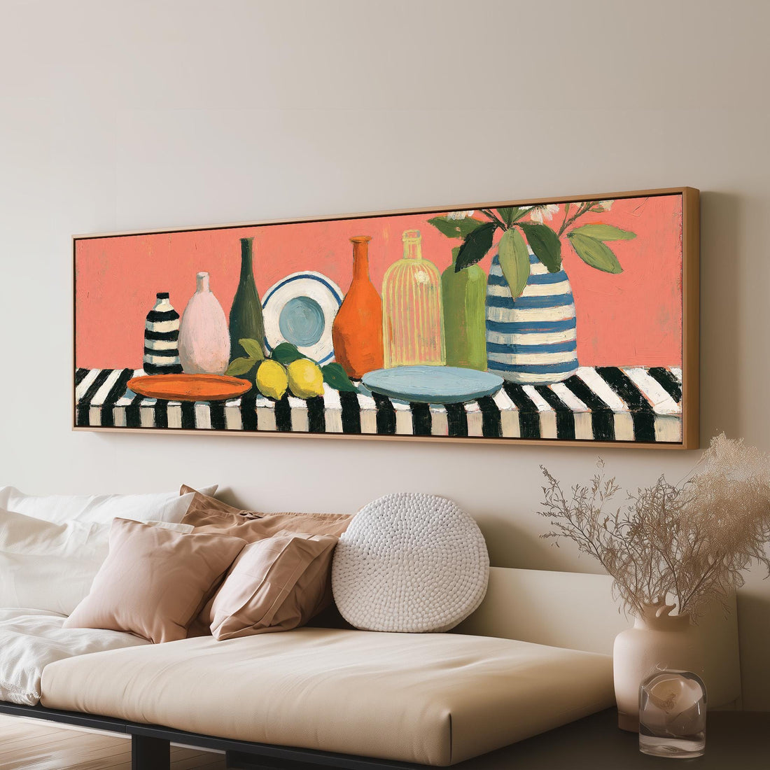 Bottles and lemons still life long horizontal canvas print above a sofa in a living room