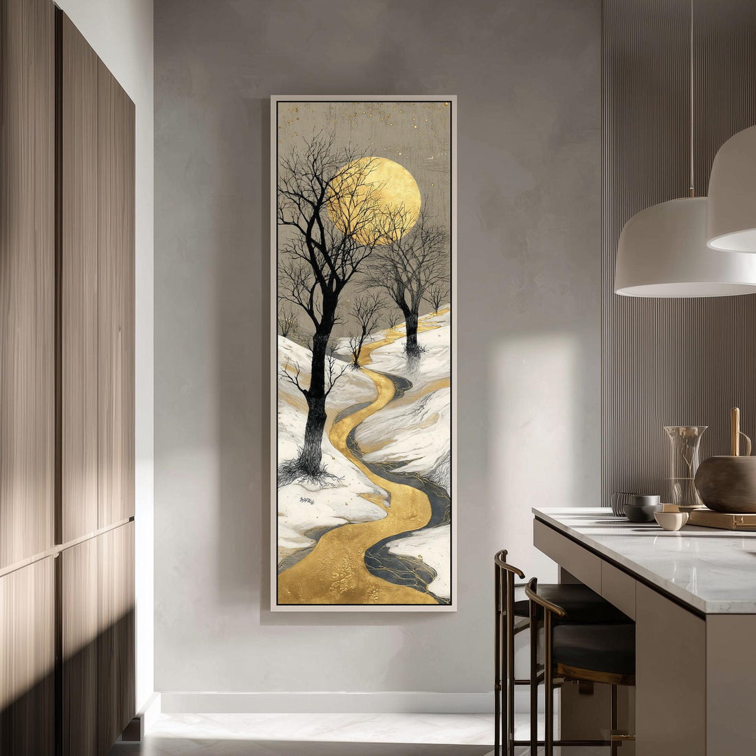 a large, framed painting of a snowy landscape with a winding path, a full moon, and bare trees. The painting is hanging on a wall in a modern, minimalist kitchen setting.