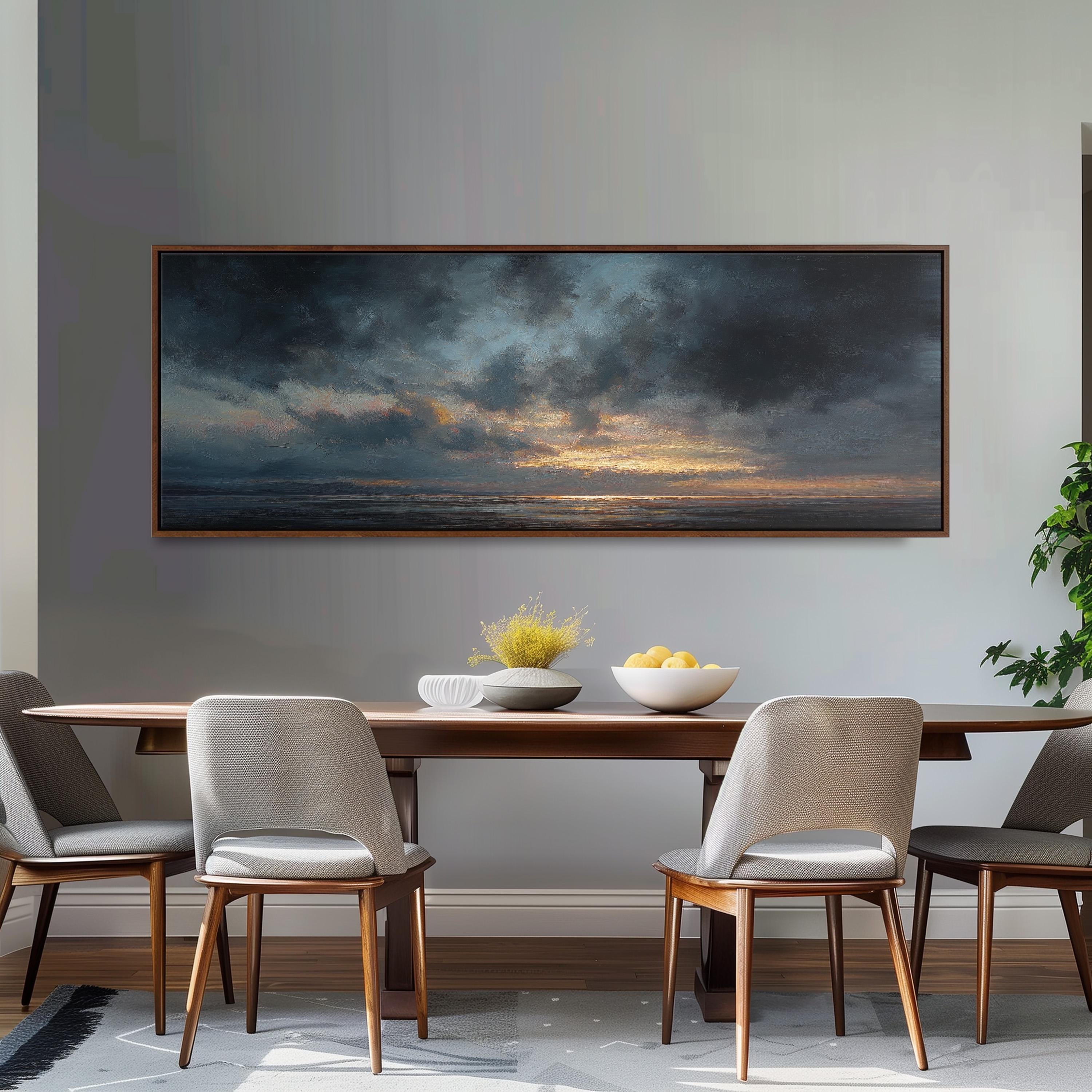 a dining room with a large painting of a cloudy sky hanging on the wall above a wooden dining table with four chairs. The table is set with a bowl of fruit and a vase of flowers, creating a cozy and inviting atmosphere.
