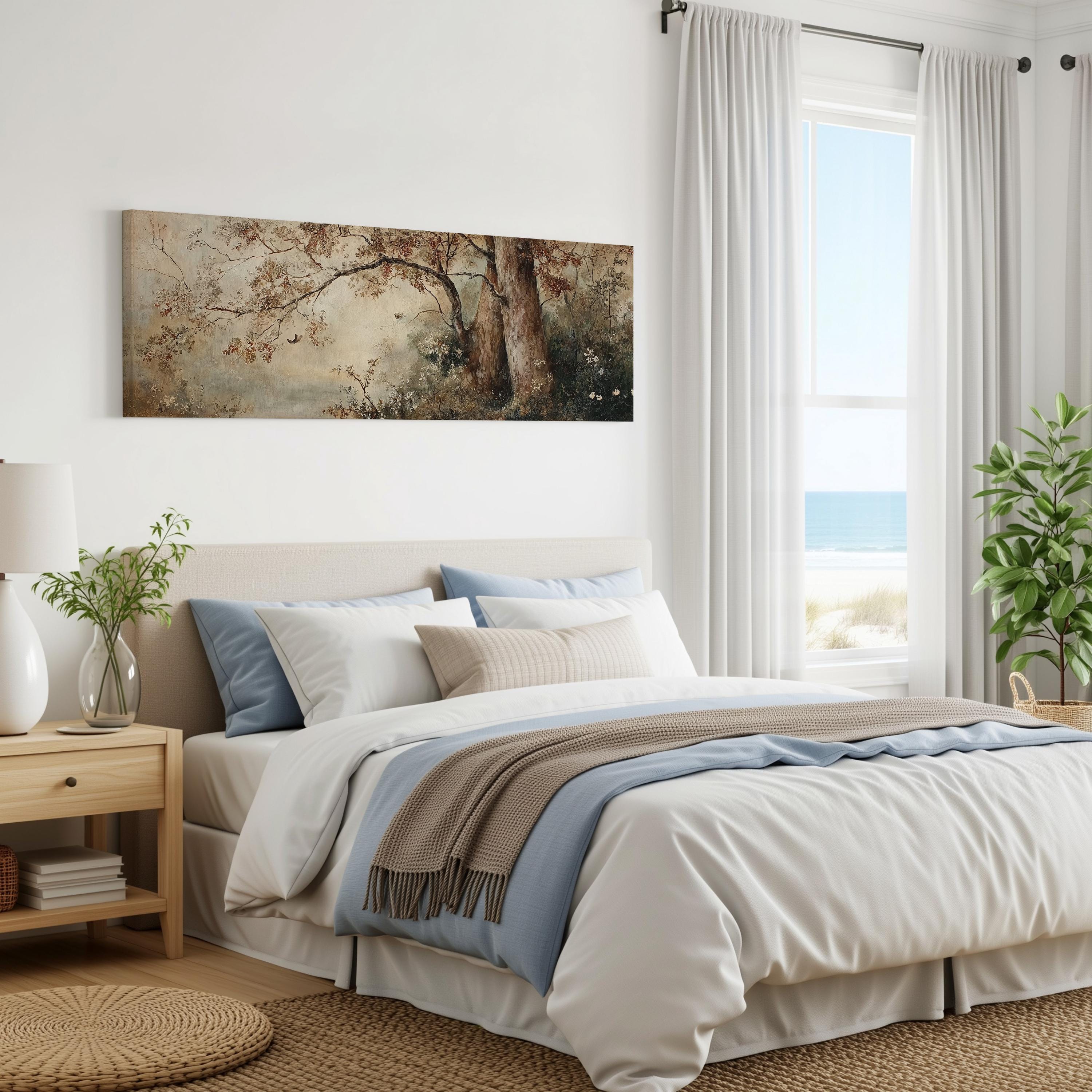 a serene bedroom with a large bed, a painting of trees on the wall, and a window overlooking the ocean.