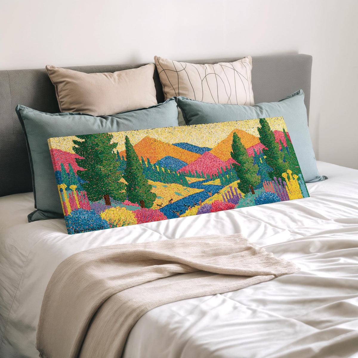Colorful pine mountain valley wide panoramic canvas print laid on a bed to show its size