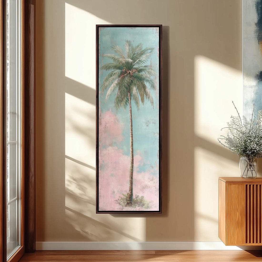 a serene bedroom scene with a large framed painting of a palm tree hanging on the wall, a white bed with a white pillow, a white vase with tall potted plants, and a woven ottoman in front of the bed.