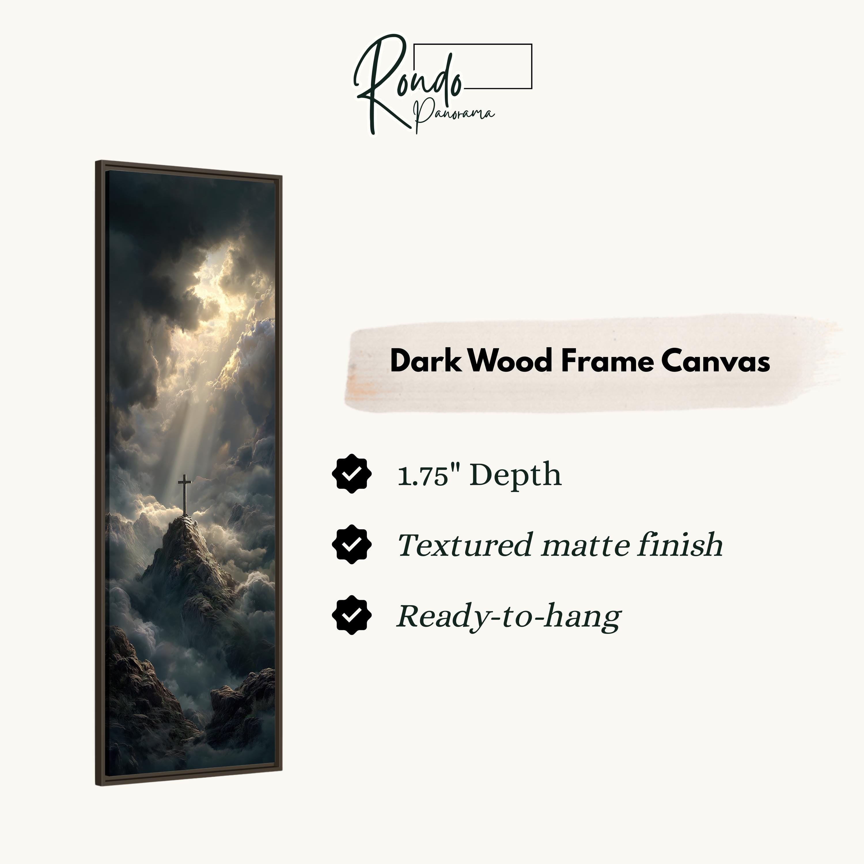 The image is a dark wood frame canvas depicting a dramatic landscape with a cross on a mountain peak, surrounded by clouds.
