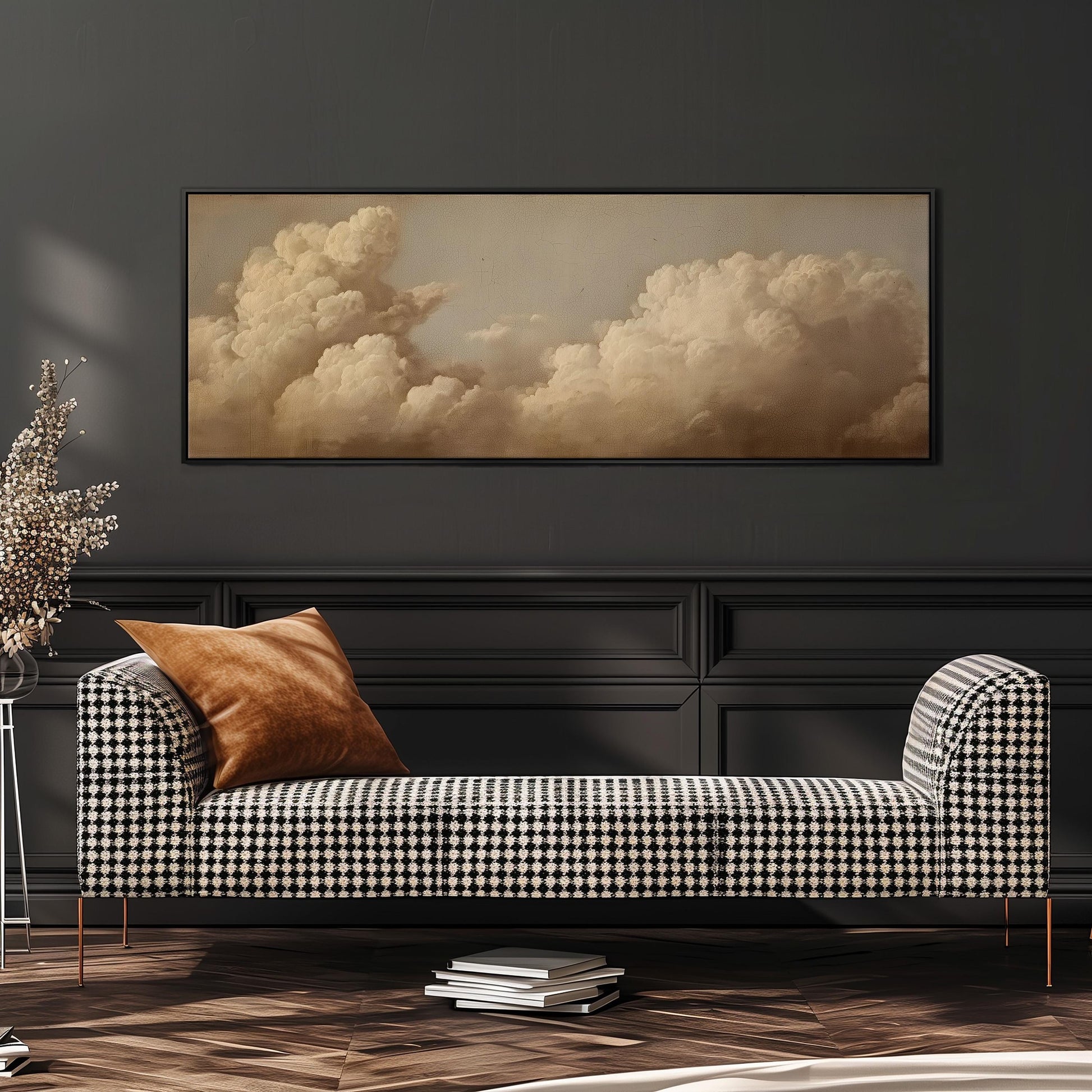 a black and white checkered sofa with a brown throw pillow, set against a dark wall with a large framed picture of a cloudy sky above it.