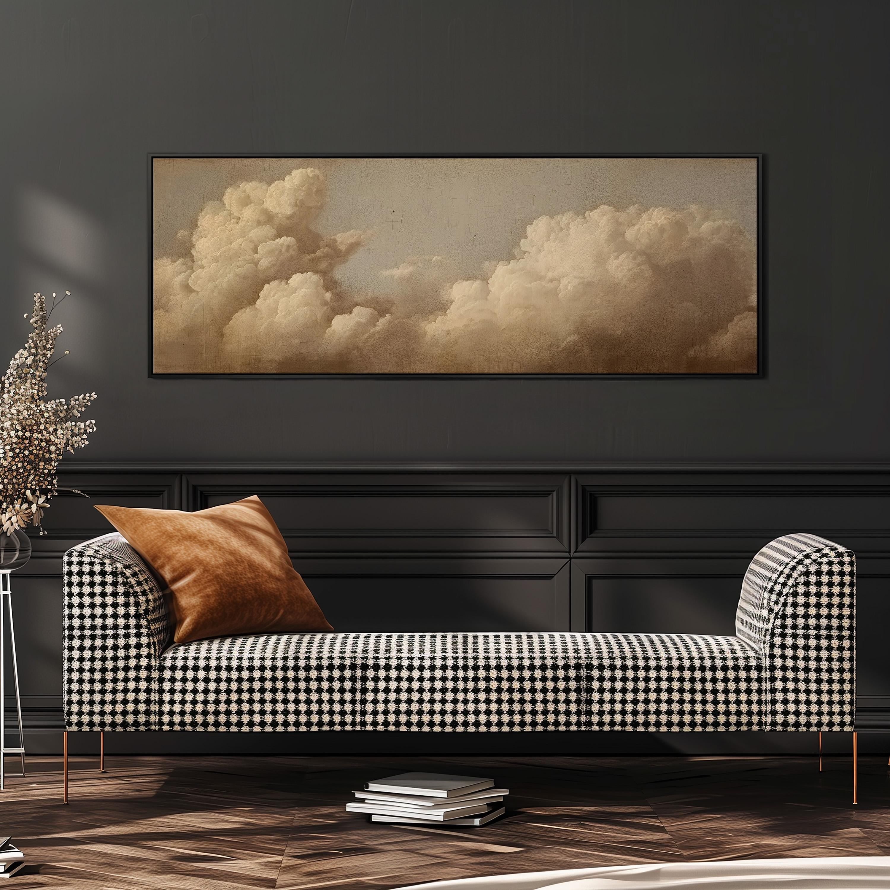 a black and white checkered sofa with a brown throw pillow, set against a dark wall with a large framed picture of a cloudy sky above it.