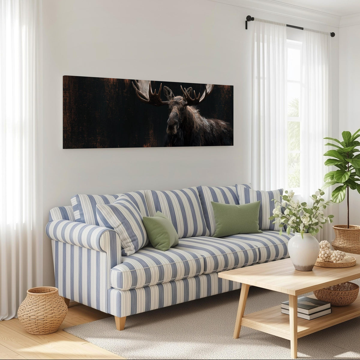 Dark moose portrait long horizontal canvas print above a striped sofa in a coastal living room