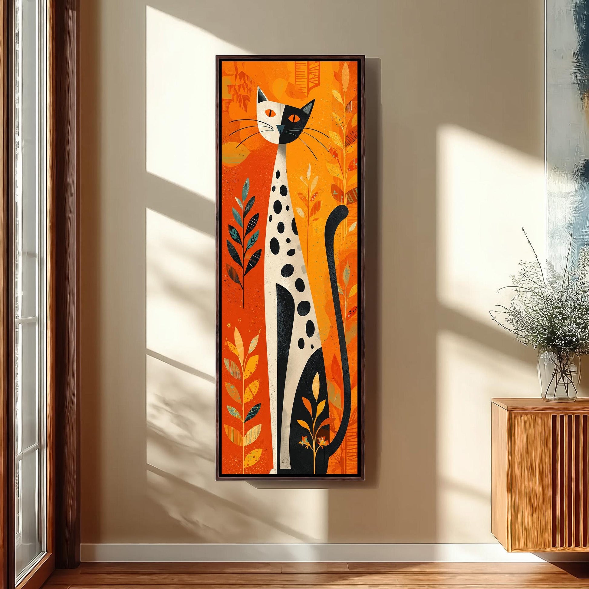 a large, colorful painting of a cat with a predominantly orange and black color scheme, hanging on a wall in a room with a wooden cabinet and a vase of flowers.