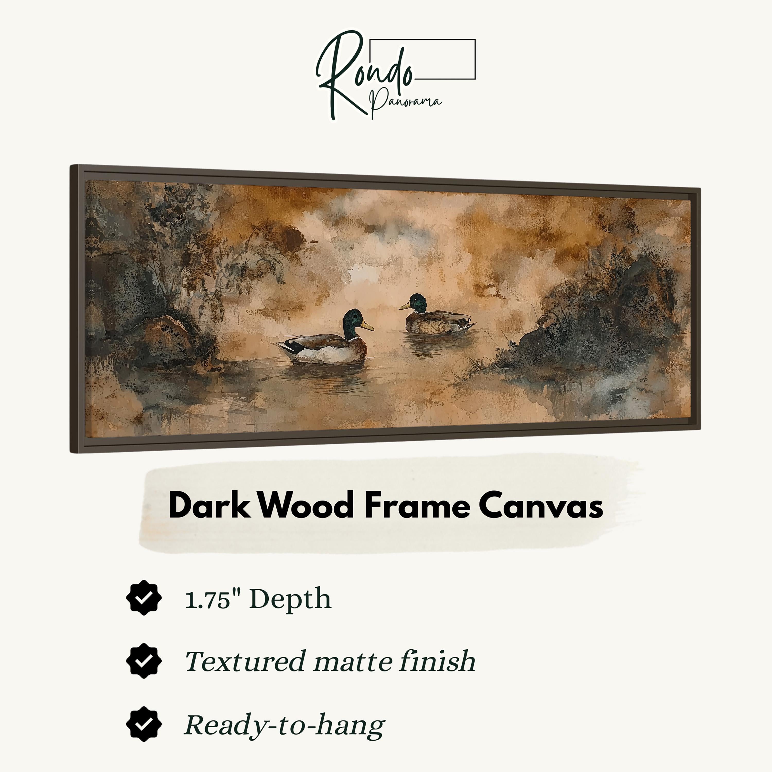 The image is a framed artwork depicting two ducks swimming in a body of water, with a dark wood frame.