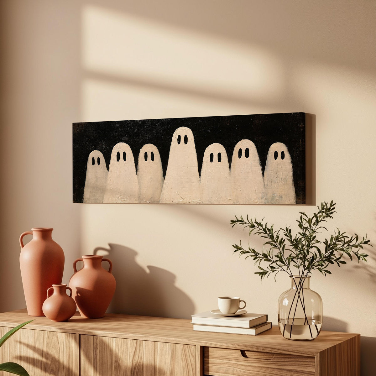Friendly ghost gang long horizontal canvas print above a wooden sideboard