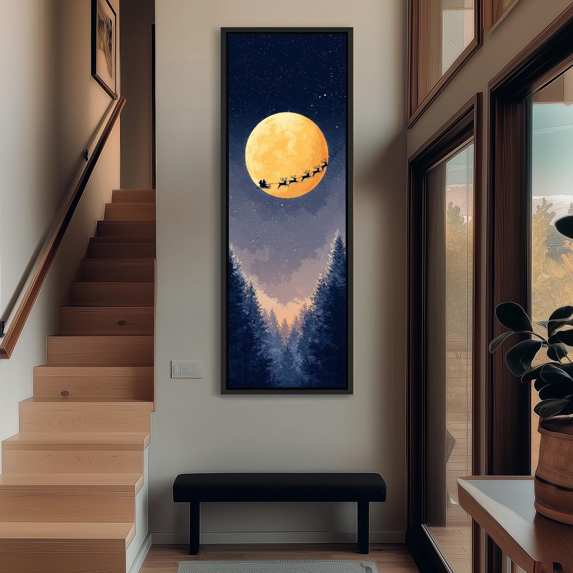 a large, framed painting of Santa Claus and reindeer flying over a snowy landscape with a full moon in the night sky.