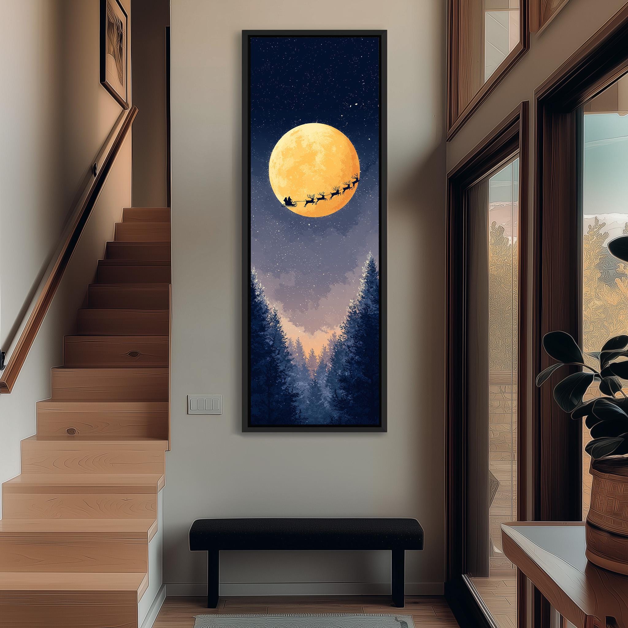 a large, framed painting of Santa Claus and reindeer flying over a snowy landscape with a full moon in the night sky.