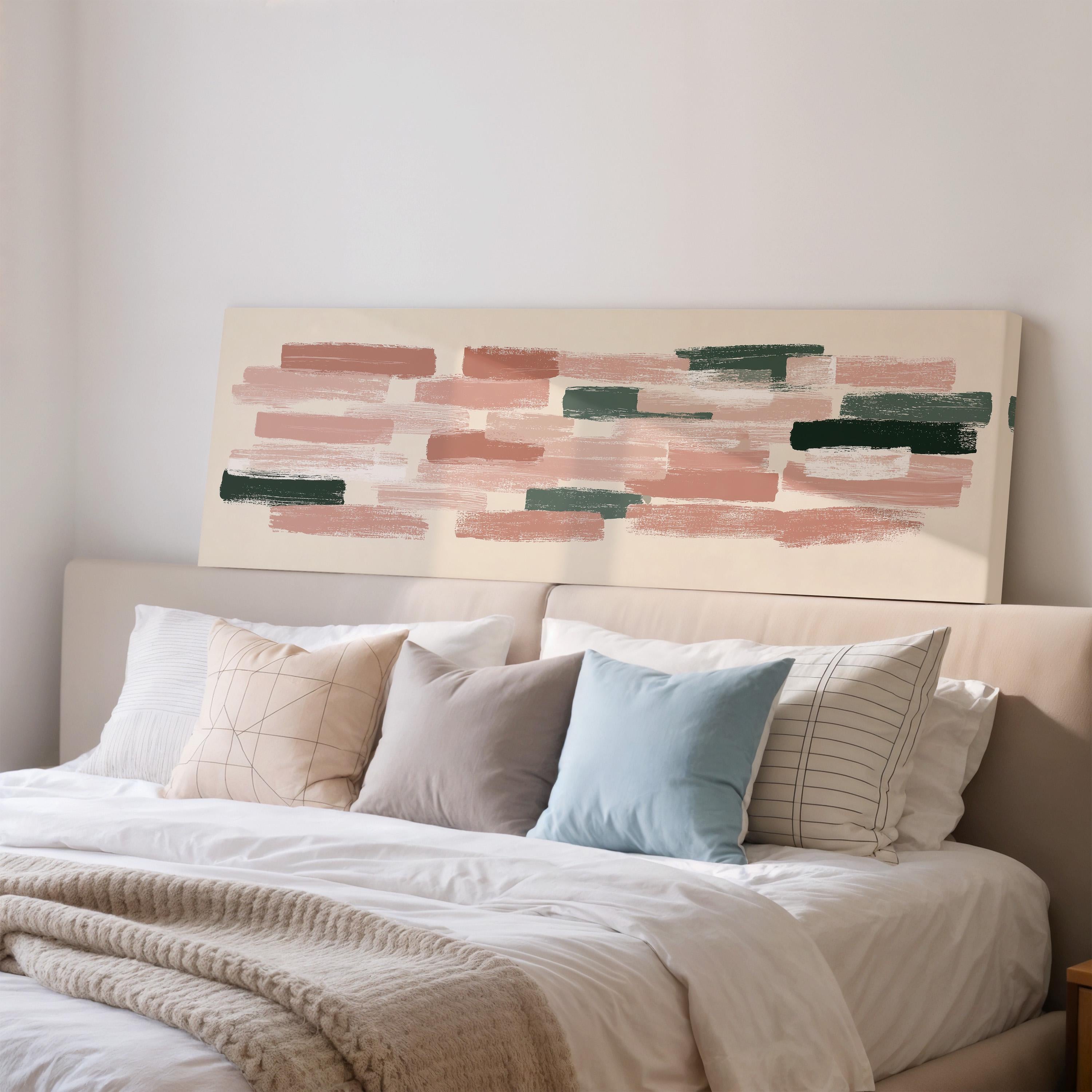 a cozy bedroom with a large bed adorned with white sheets and a variety of colorful throw pillows. Above the bed, there is a large abstract painting featuring pink and green brushstrokes.