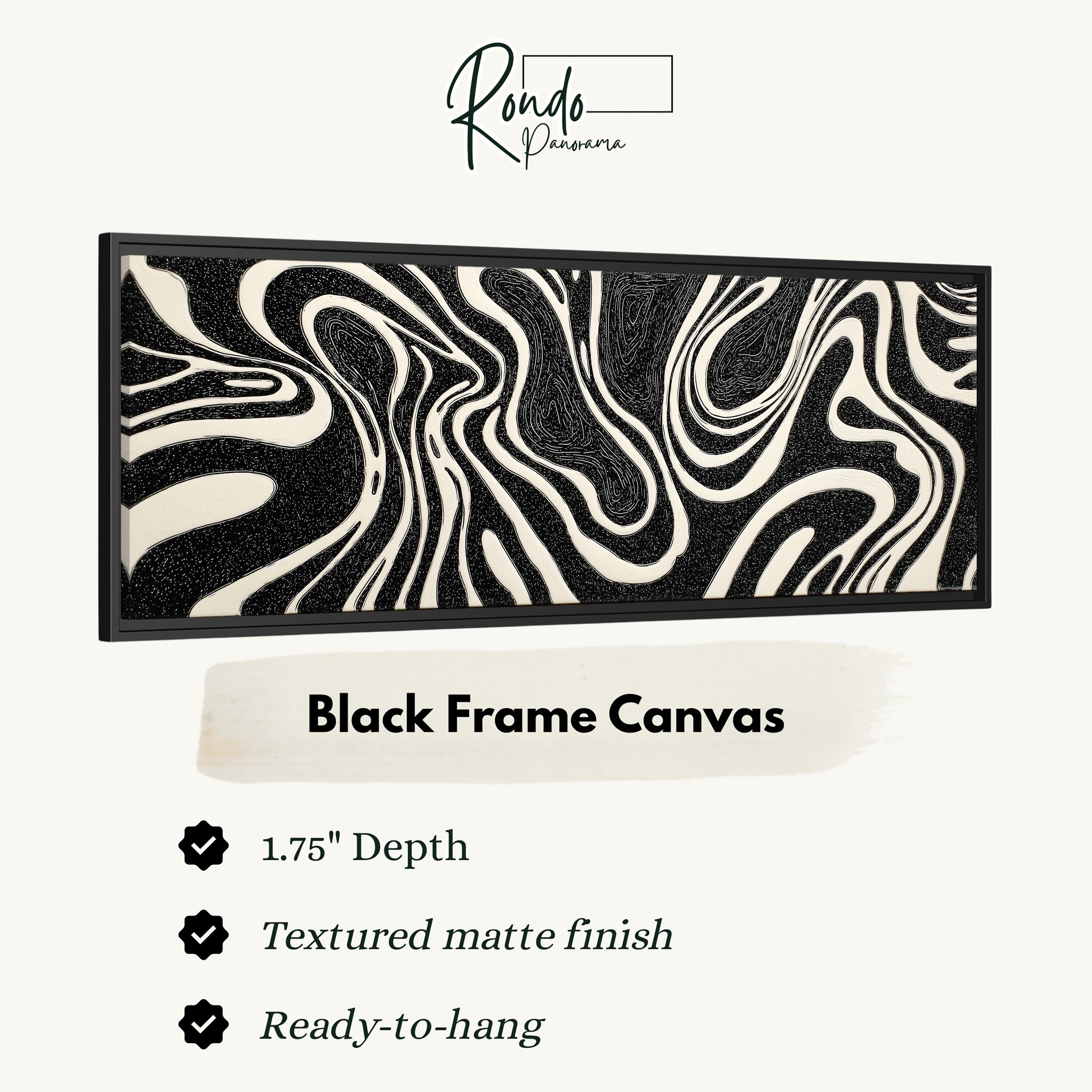a black frame canvas with a black and white abstract design.