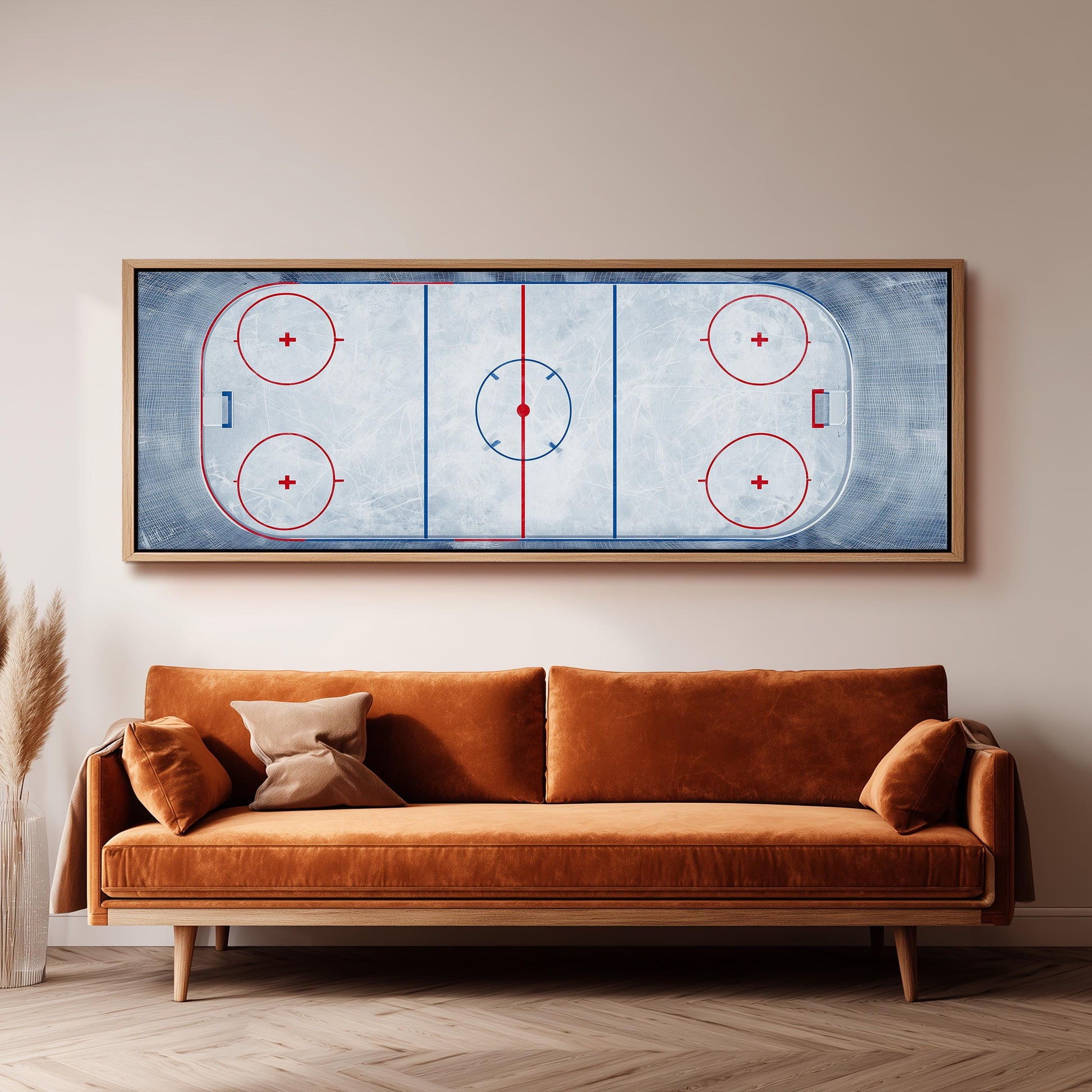 a large framed hockey rink with a red and blue design on the ice, mounted on a wall above a brown sofa.