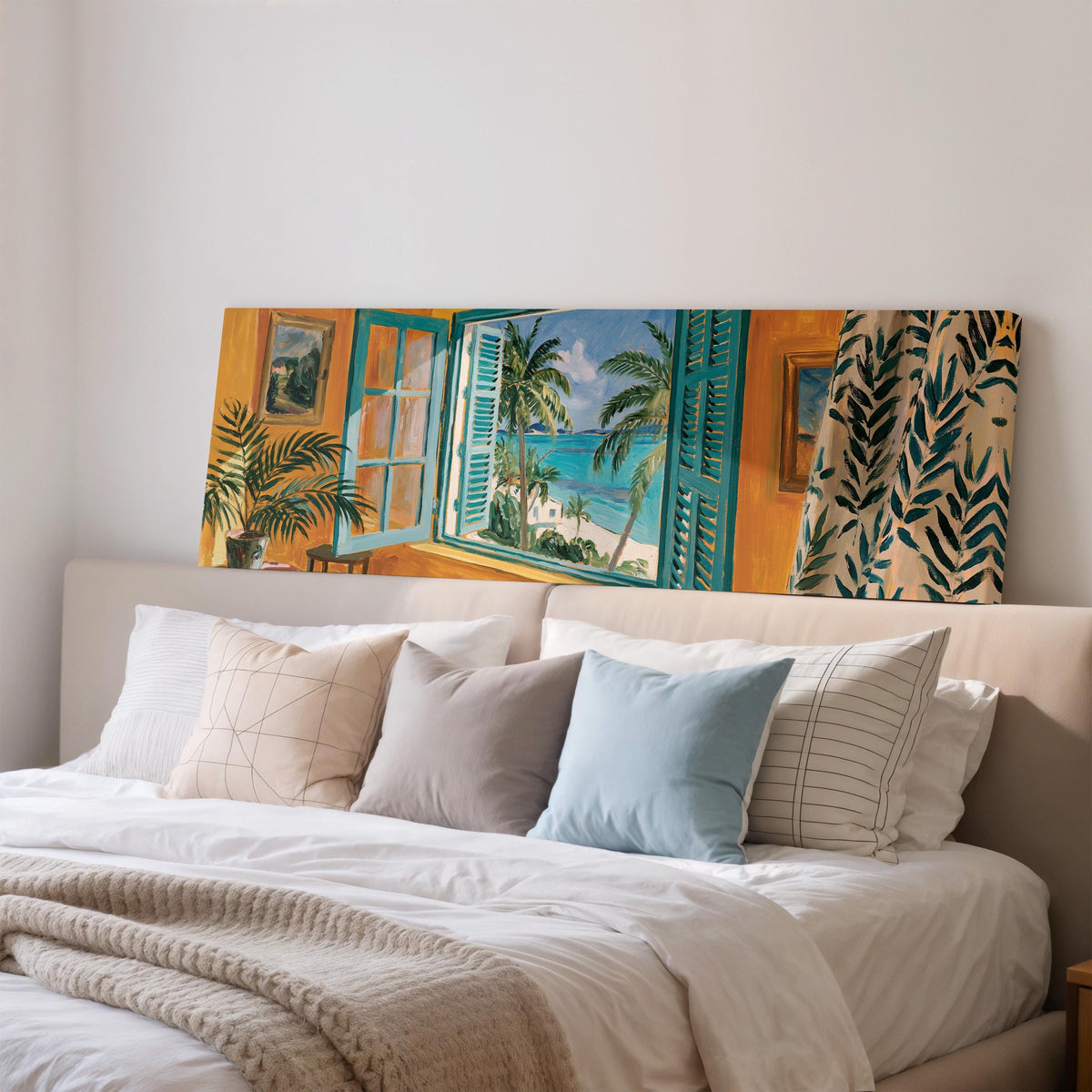 Beach house window overlooking palms and sea wide panoramic canvas print above a bed in a bedroom