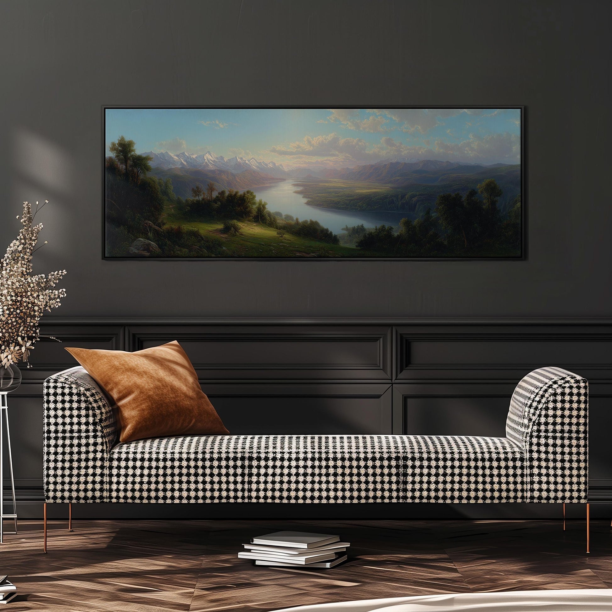 a large landscape painting hanging on a wall above a black and white checkered sofa with a brown throw pillow.